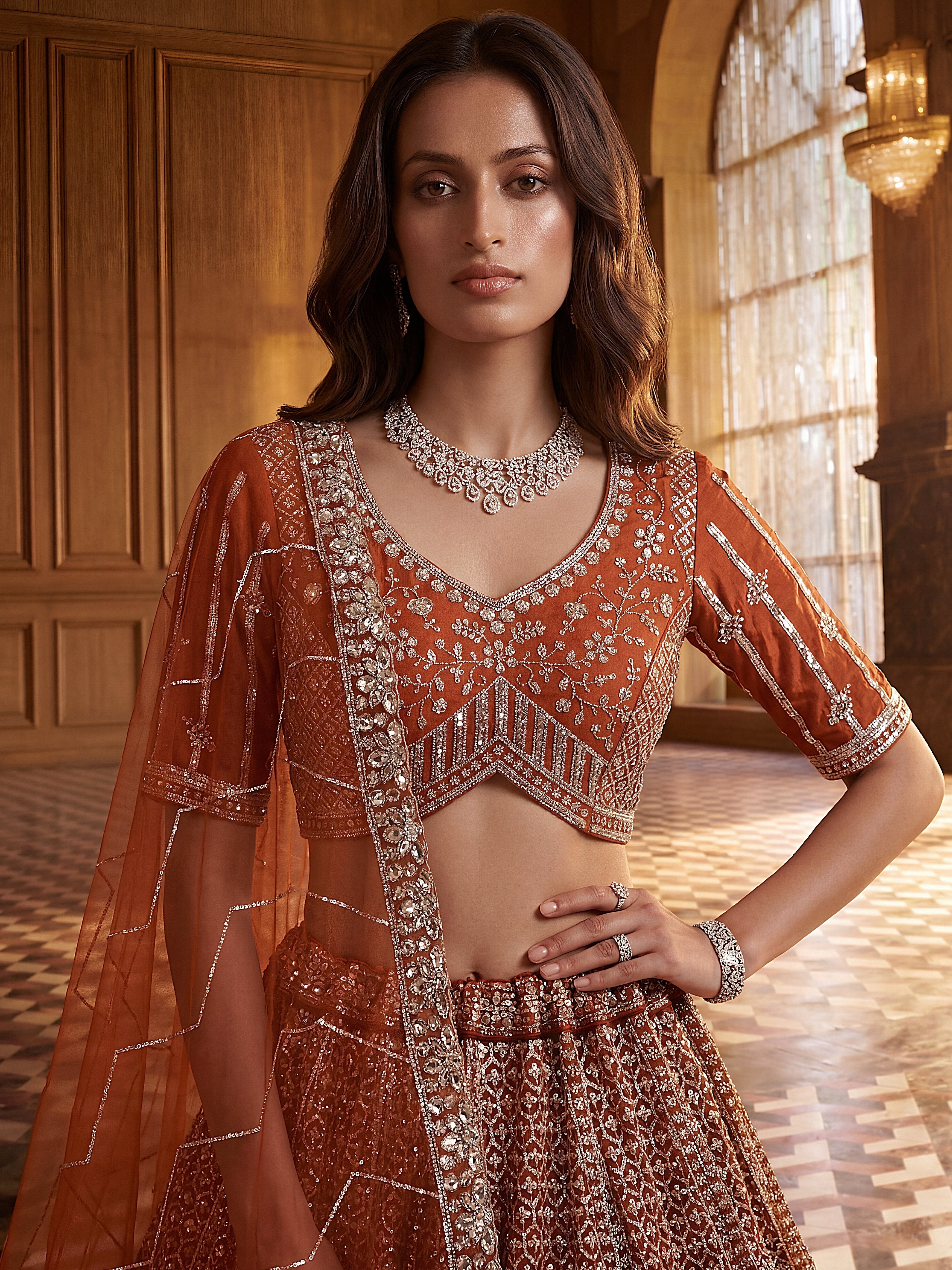 Wonderful Rust Orange Sequins Net Wedding Wear Lehenga Choli