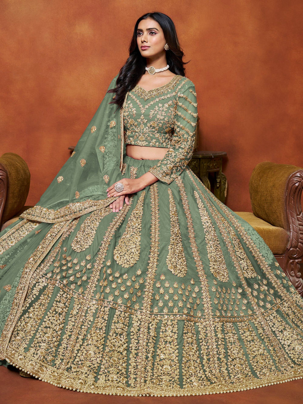 Dazzling Pista Green Embroidered Net Designer Lehenga With Blouse