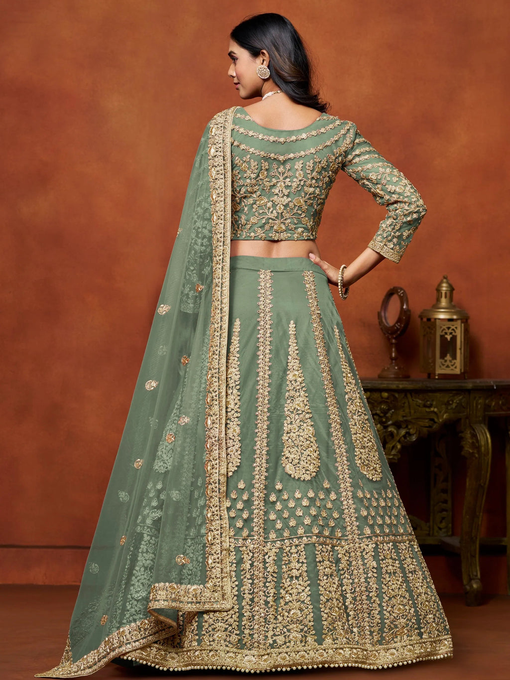 Dazzling Pista Green Embroidered Net Designer Lehenga With Blouse