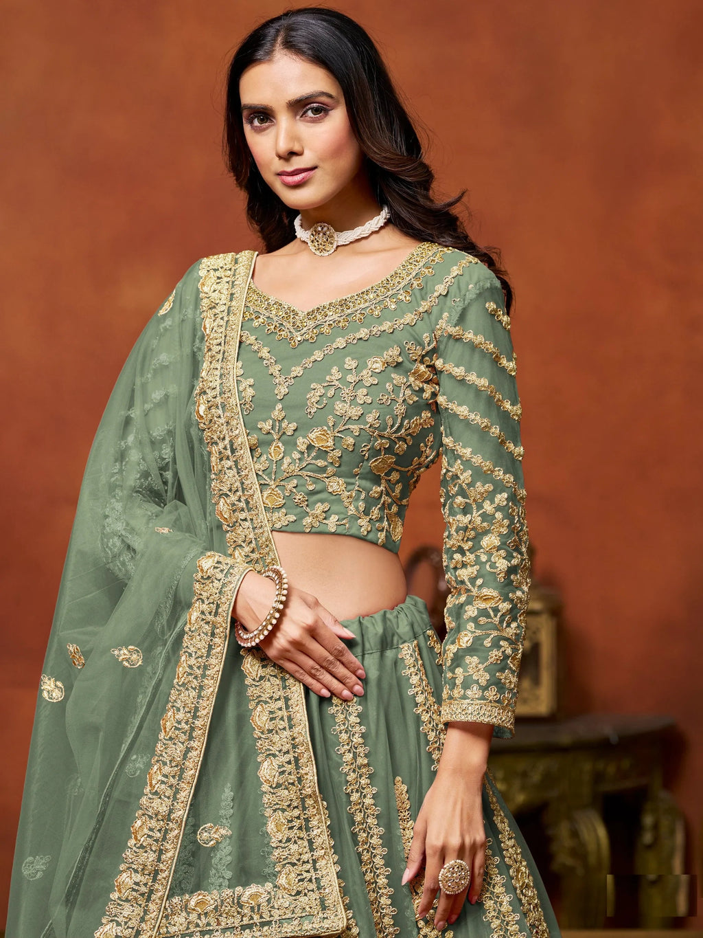Dazzling Pista Green Embroidered Net Designer Lehenga With Blouse