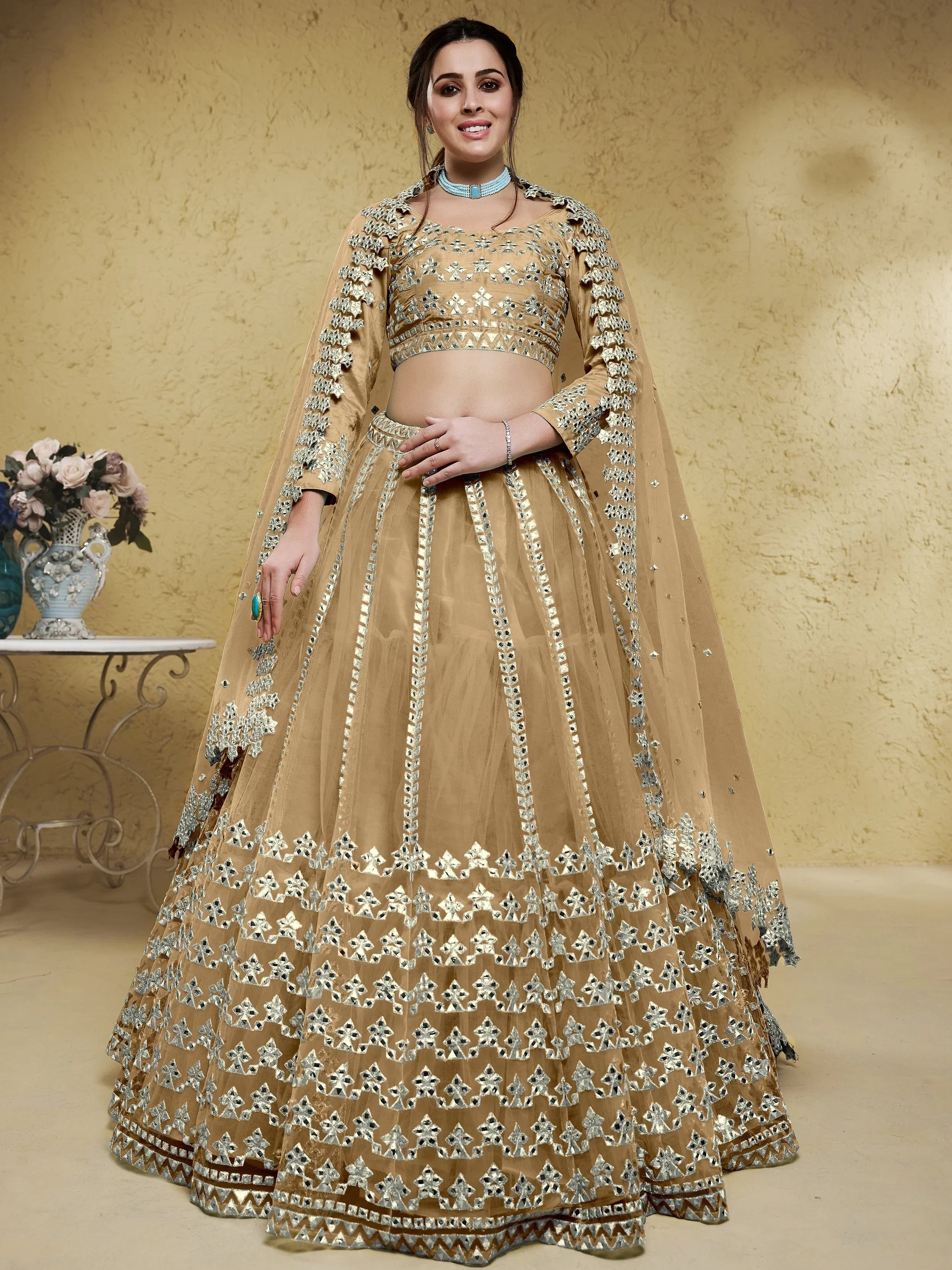 Beige Stunning Foil Work Net Wedding Lehenga Choli With Dupatta