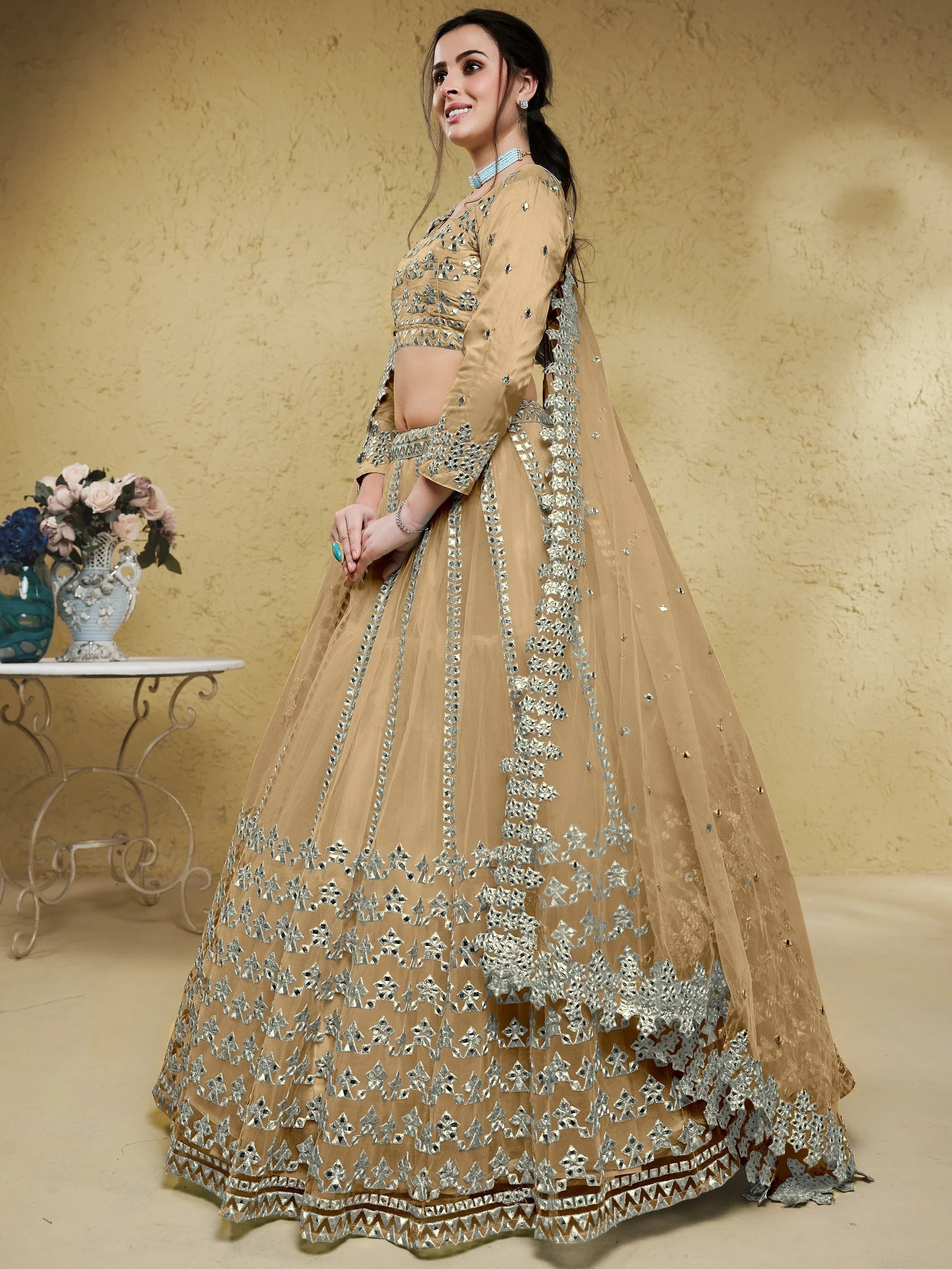 Beige Stunning Foil Work Net Wedding Lehenga Choli With Dupatta
