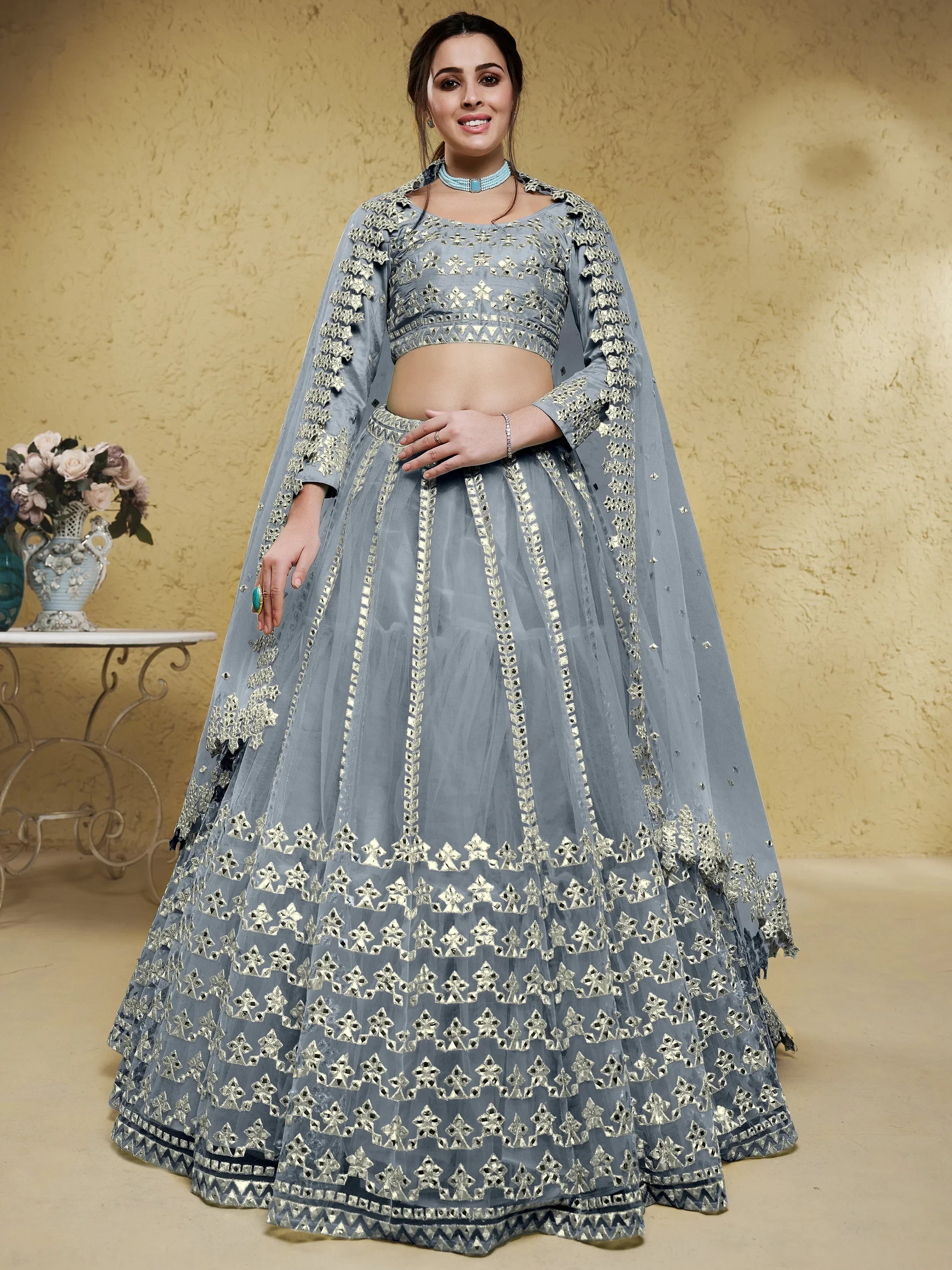 Grey Stunning Foil Work Net Wedding Lehenga Choli With Dupatta