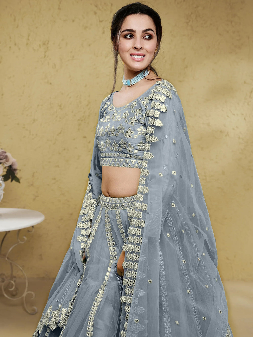 Grey Stunning Foil Work Net Wedding Lehenga Choli With Dupatta