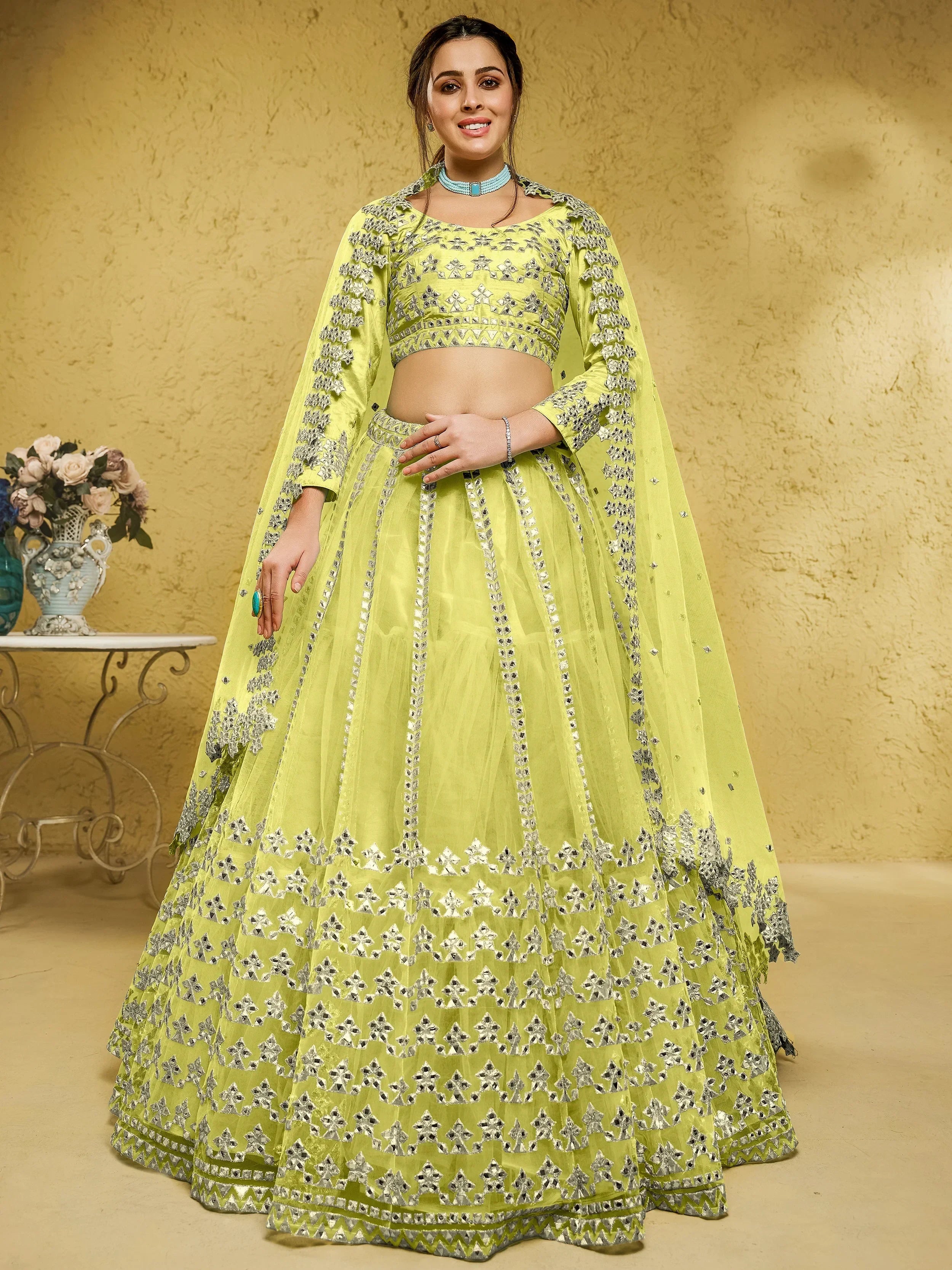 Yellow Stunning Foil Work Net Wedding Lehenga Choli With Dupatta