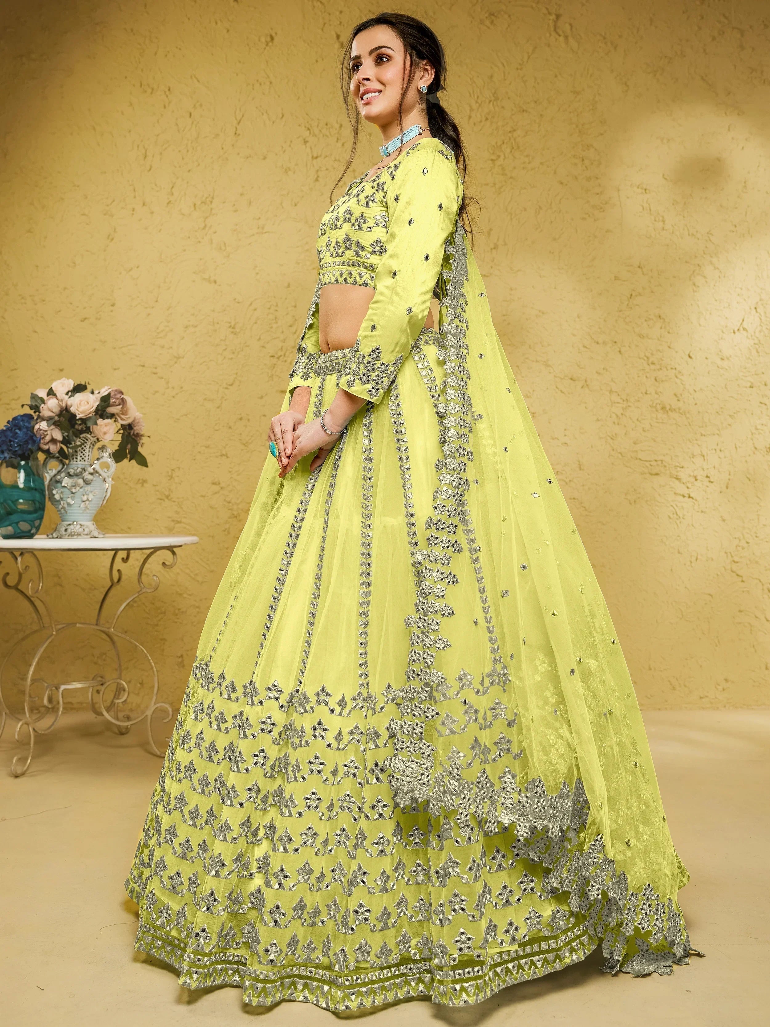 Yellow Stunning Foil Work Net Wedding Lehenga Choli With Dupatta