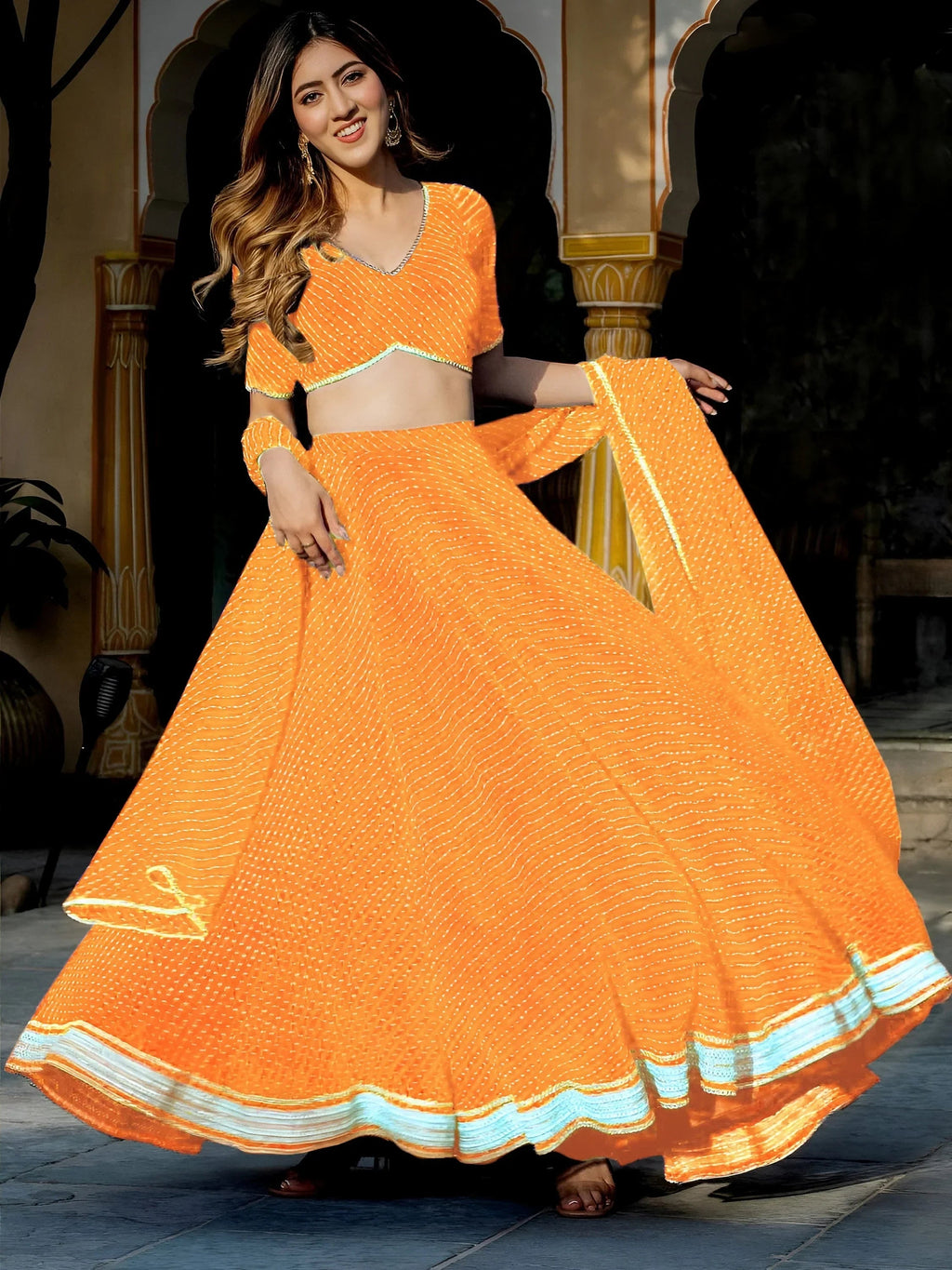 Orange Gorgeous Laheriya Print Georgette Wedding Wear Lehenga Choli