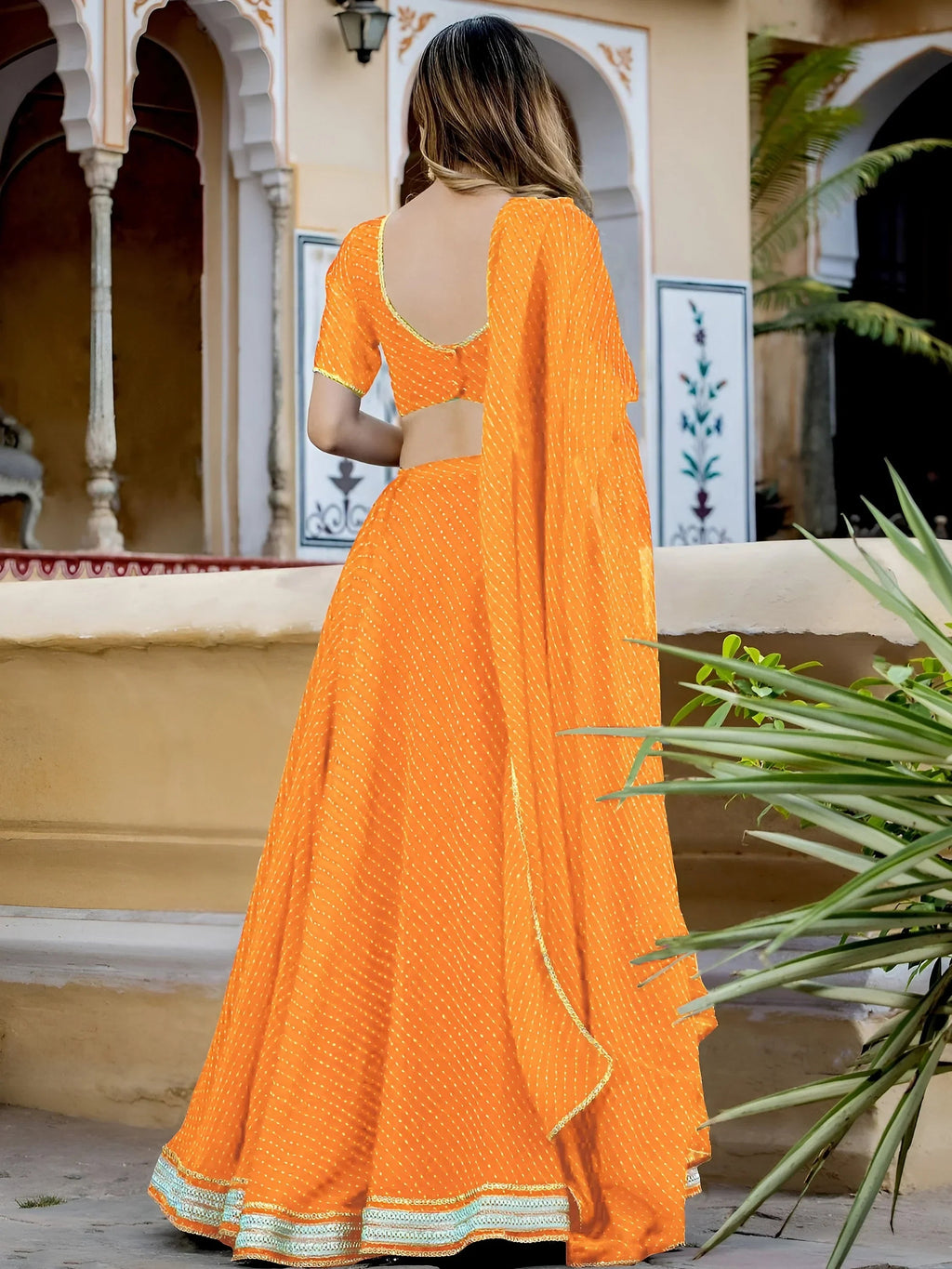 Orange Gorgeous Laheriya Print Georgette Wedding Wear Lehenga Choli
