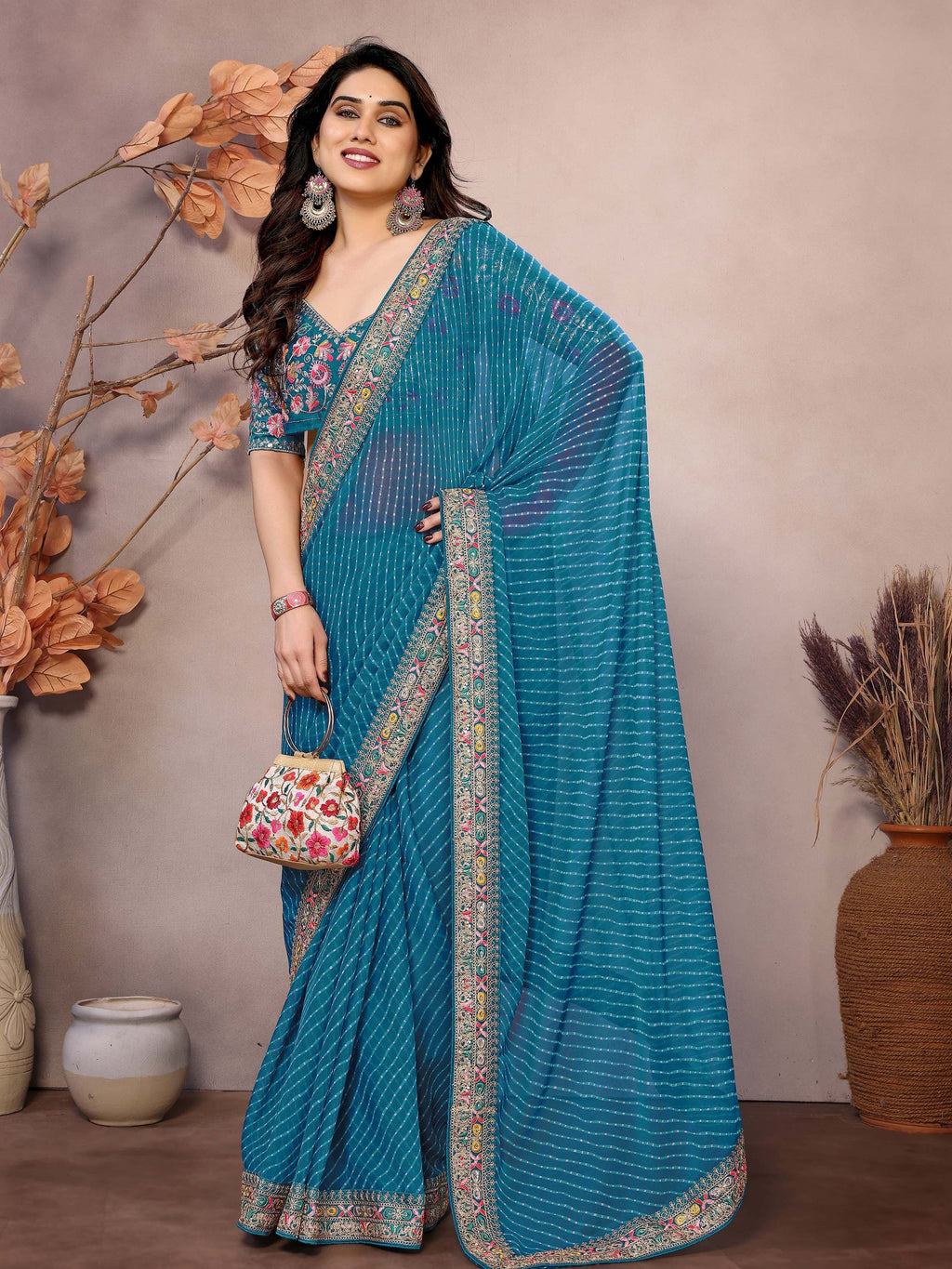 Teal Attractive Georgette Thread Embroidered Saree