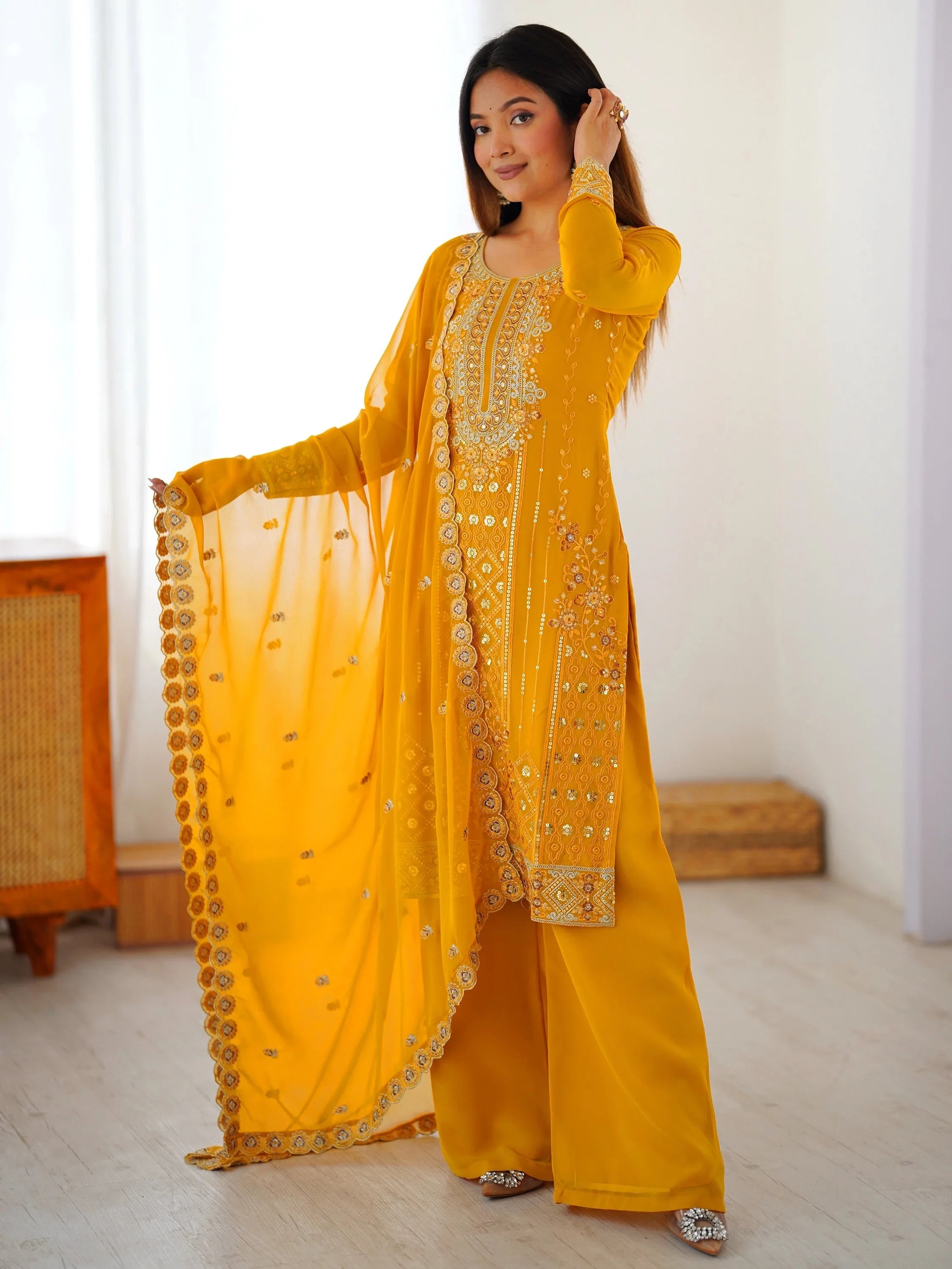 Yellow Outstanding Embroidered Georgette Haldi Wear Palazzo Suit