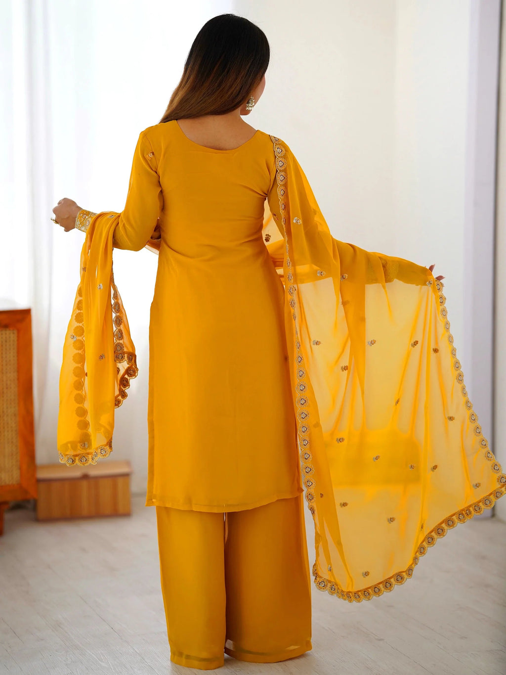 Yellow Outstanding Embroidered Georgette Haldi Wear Palazzo Suit