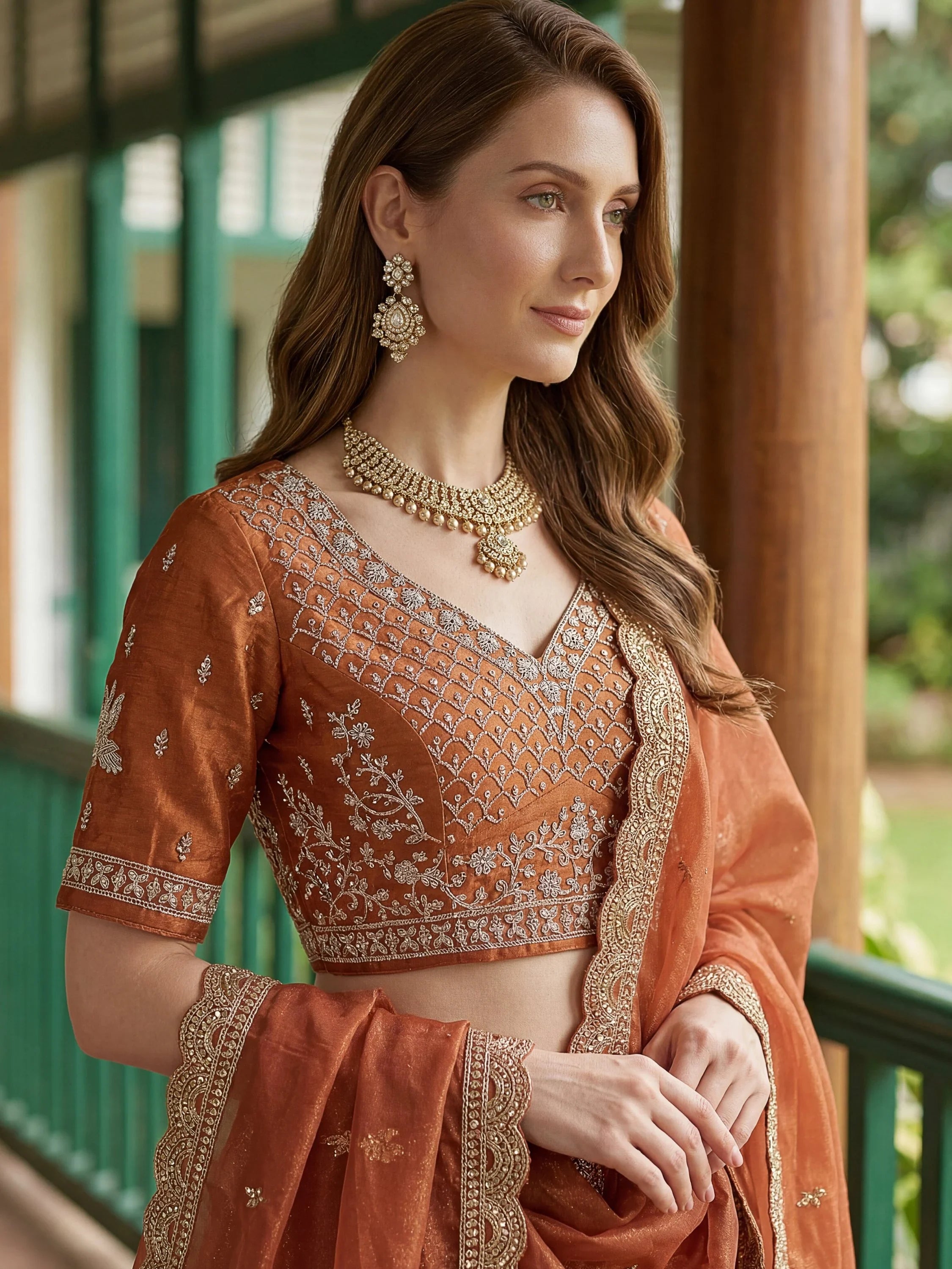 Rust Rich Diamond Work Organza Mehendi Wear Lehenga Choli