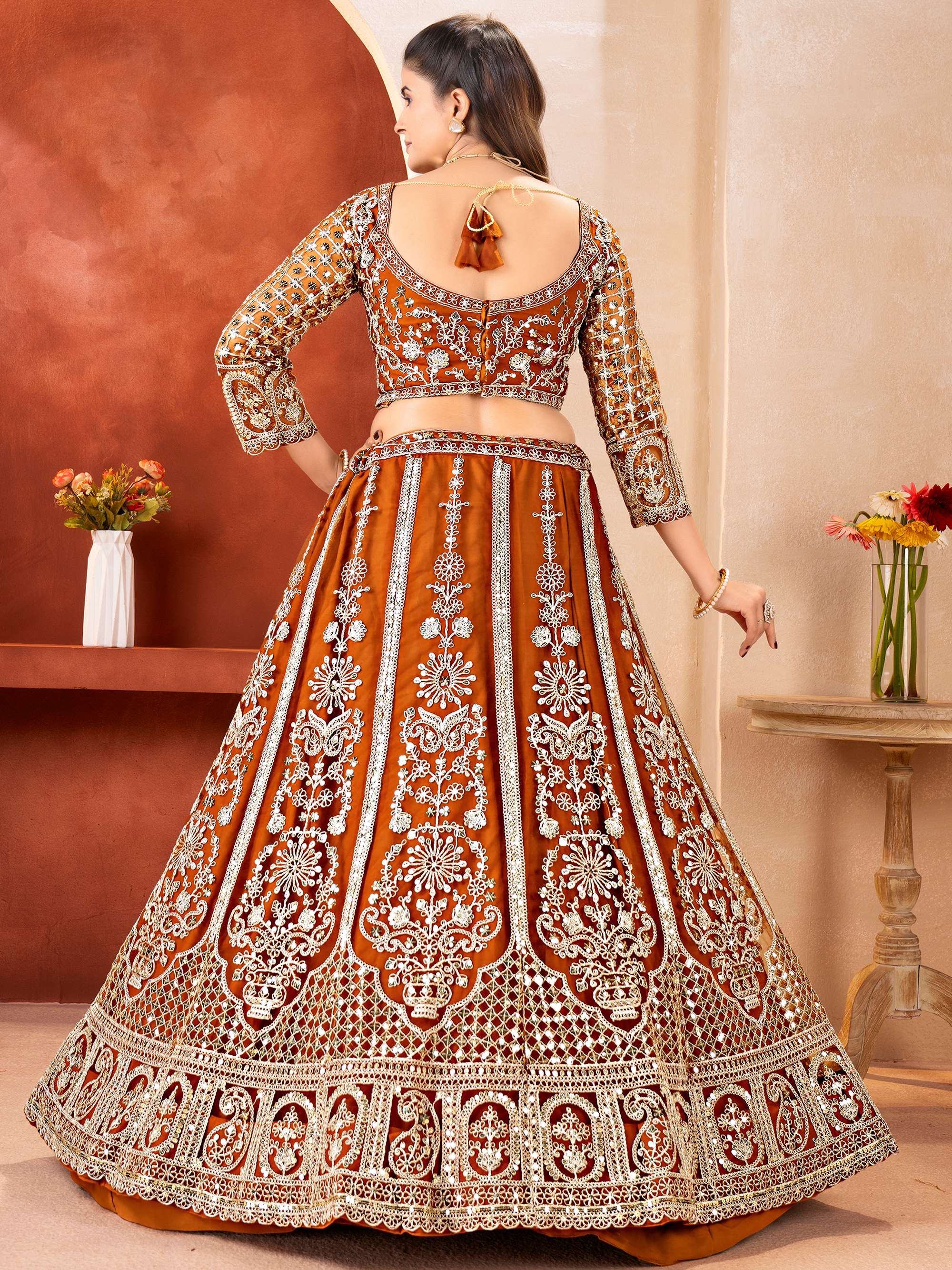 Orange Fabulous Embroidered Net Reception Wear Lehenga Choli