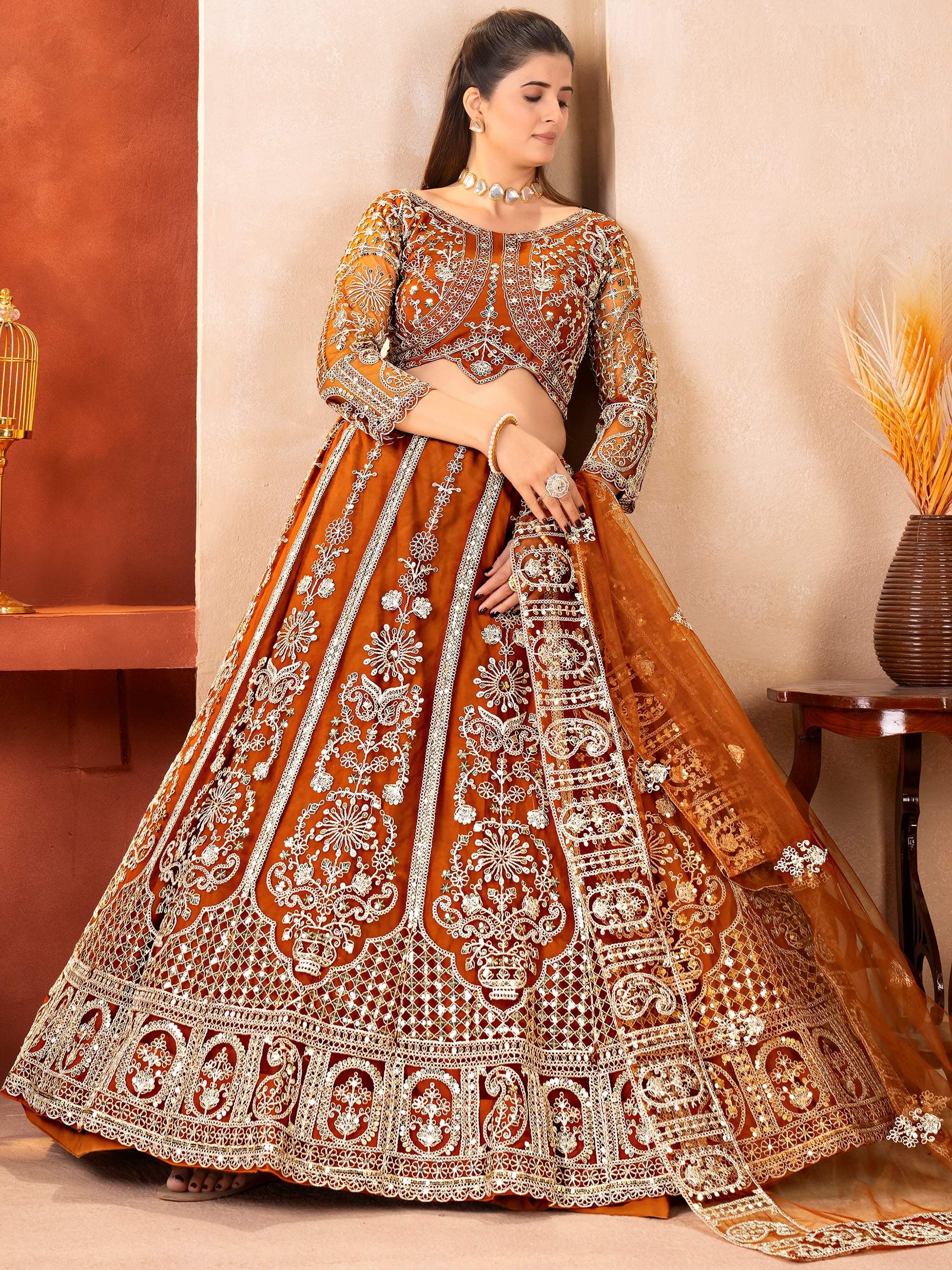 Orange Fabulous Embroidered Net Reception Wear Lehenga Choli