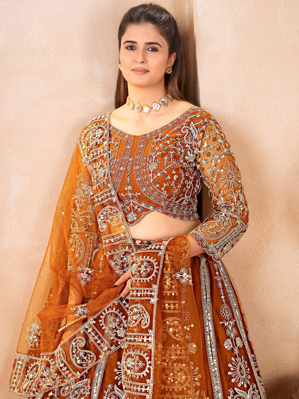 Orange Fabulous Embroidered Net Reception Wear Lehenga Choli