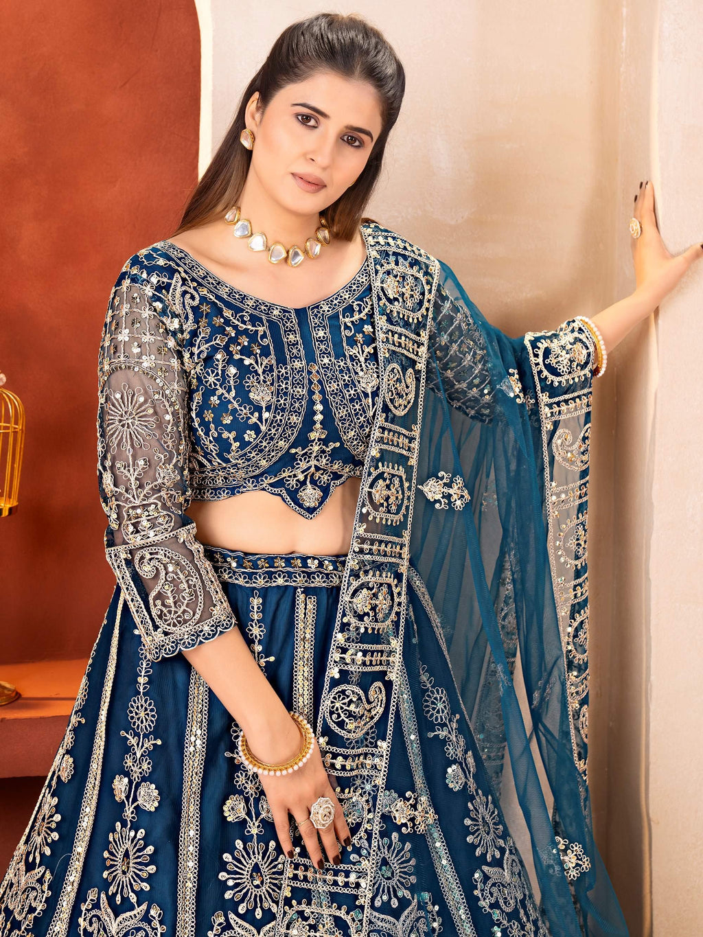 Teal Fabulous Embroidered Net Reception Wear Lehenga Choli