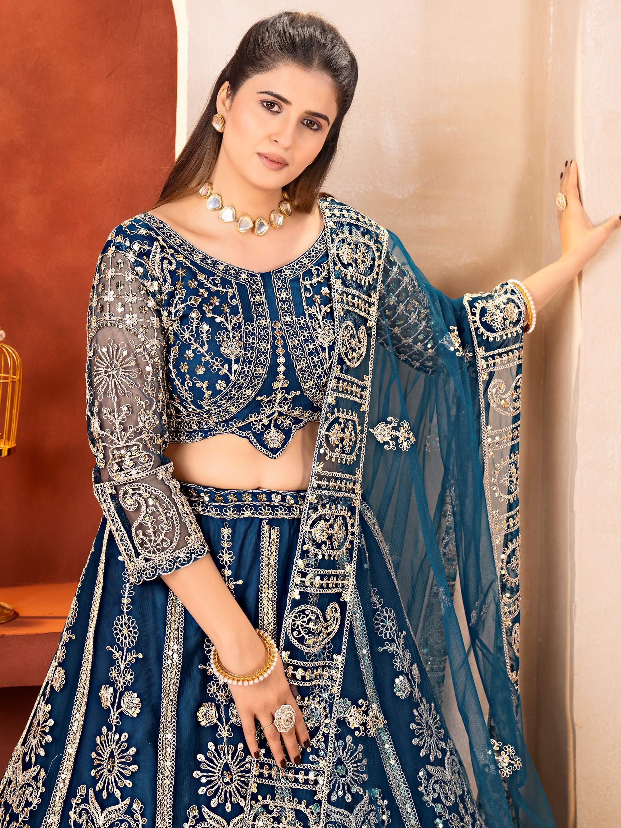 Teal Fabulous Embroidered Net Reception Wear Lehenga Choli