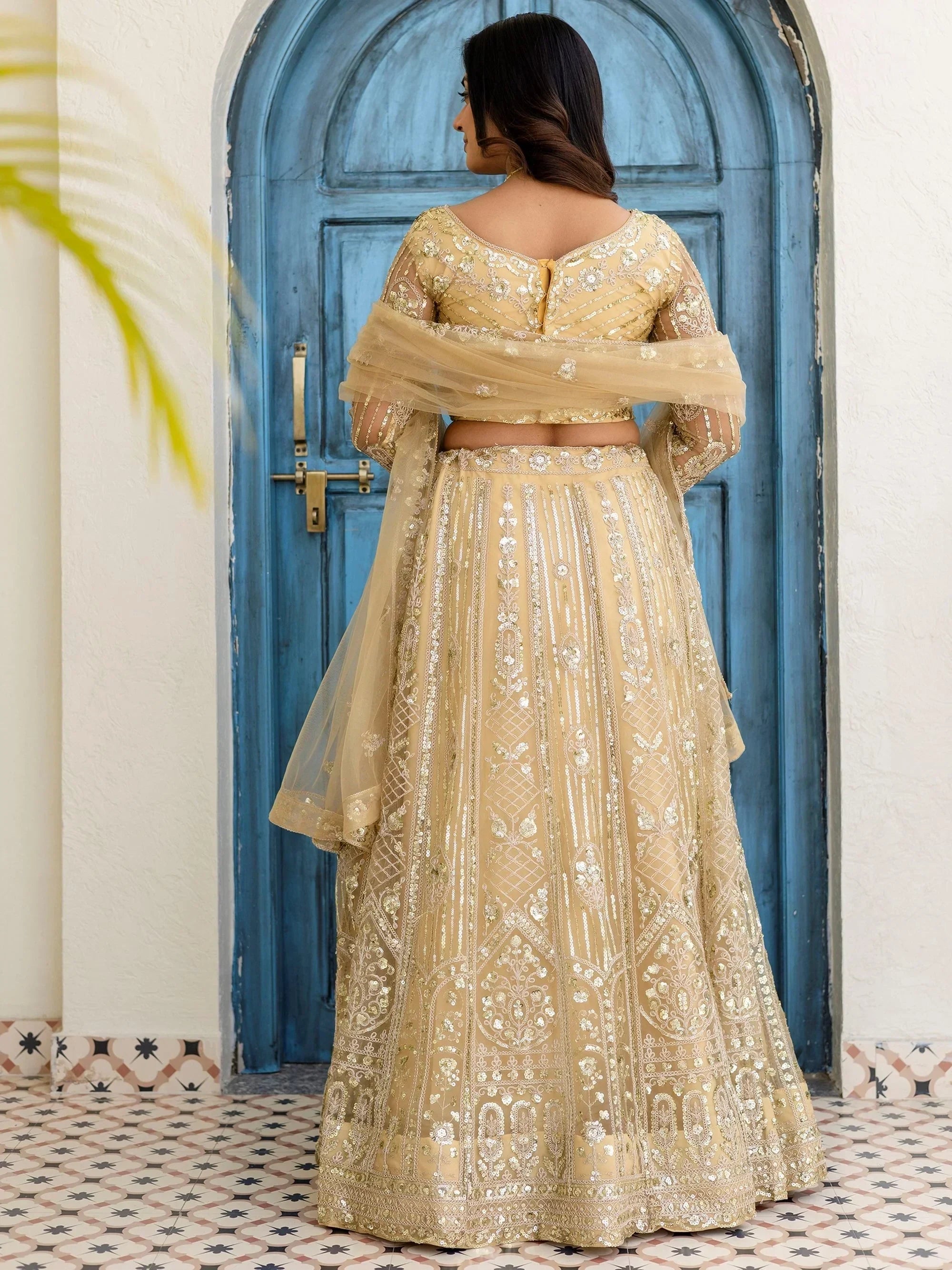 Cream Amazing Sequins Embroidered Net Party Wear Lehenga Choli