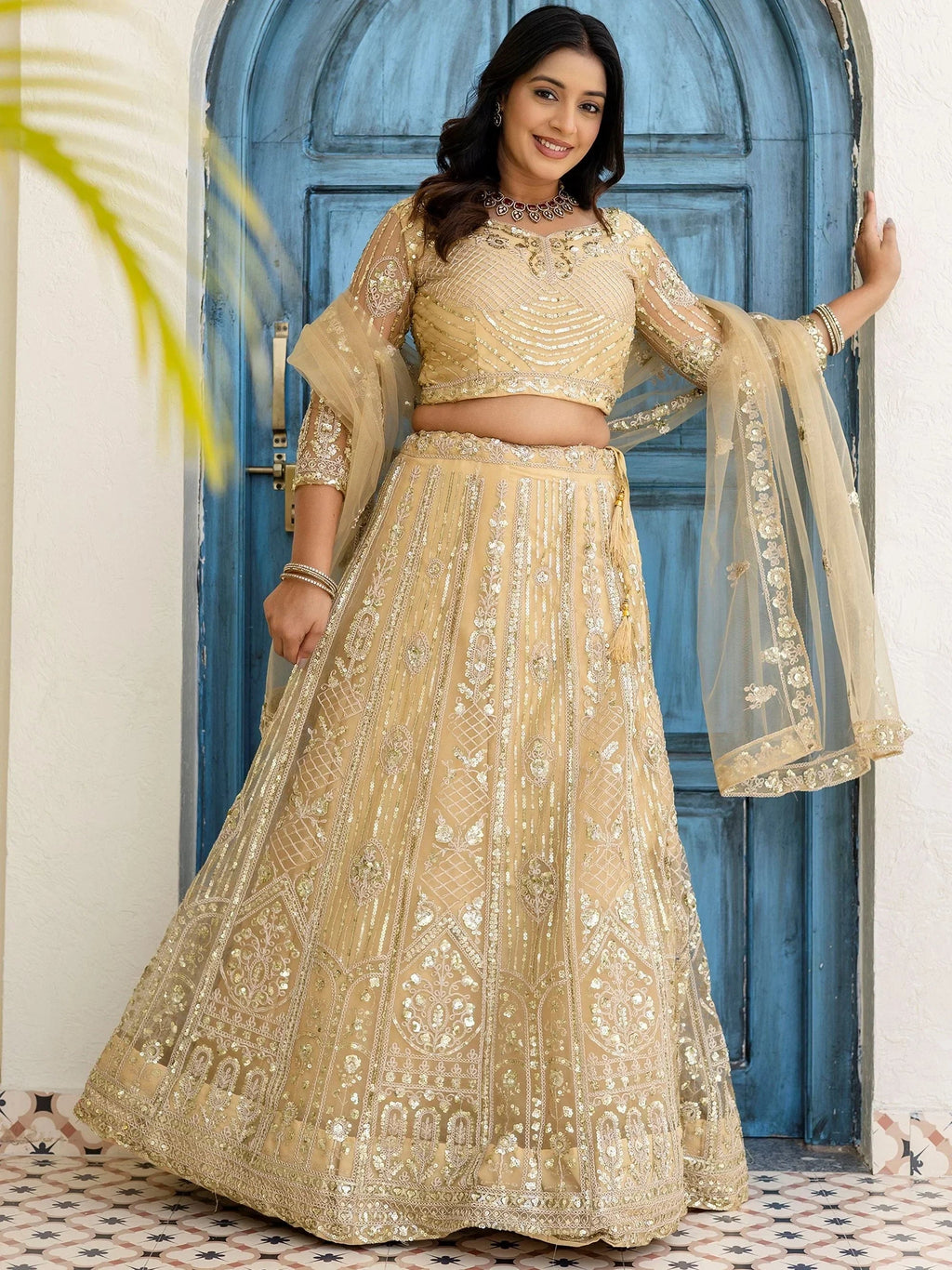 Cream Amazing Sequins Embroidered Net Party Wear Lehenga Choli