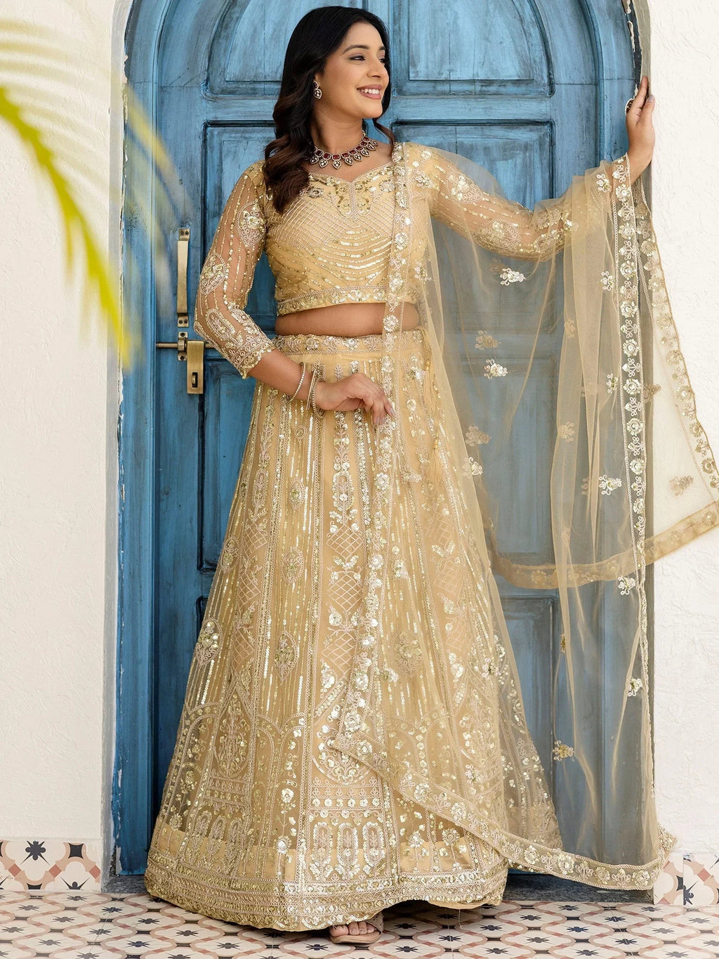 Cream Amazing Sequins Embroidered Net Party Wear Lehenga Choli