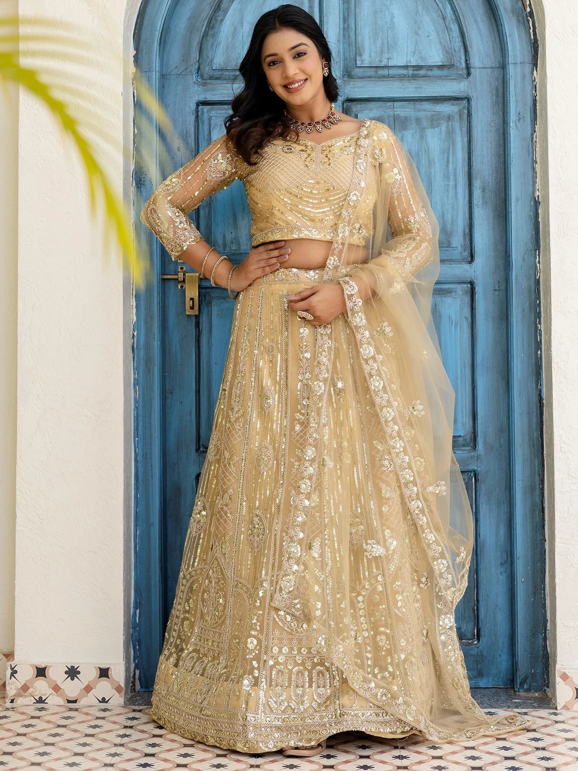 Cream Amazing Sequins Embroidered Net Party Wear Lehenga Choli
