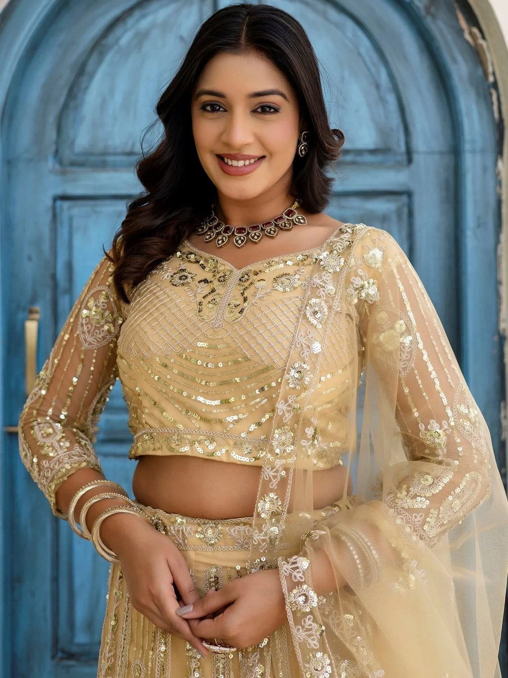 Cream Amazing Sequins Embroidered Net Party Wear Lehenga Choli