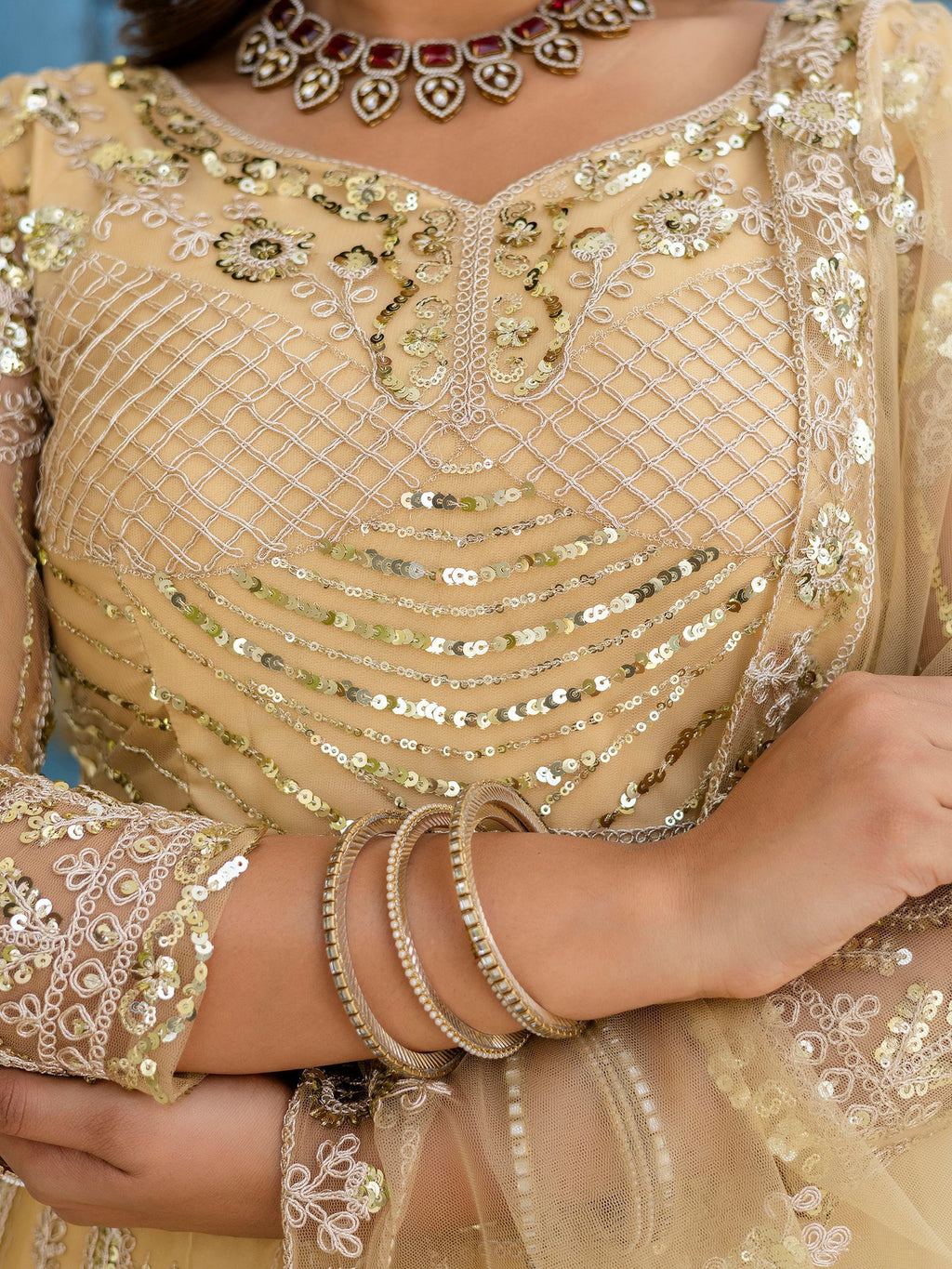 Cream Amazing Sequins Embroidered Net Party Wear Lehenga Choli