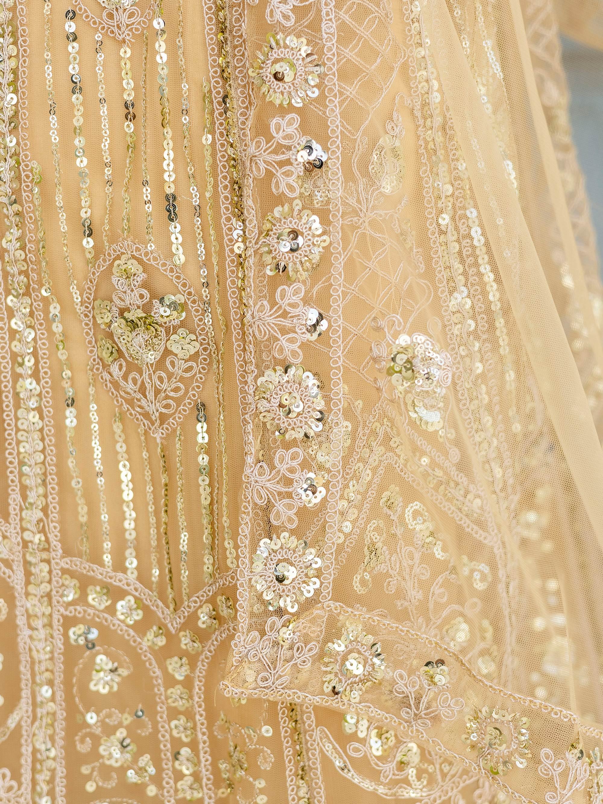 Cream Amazing Sequins Embroidered Net Party Wear Lehenga Choli