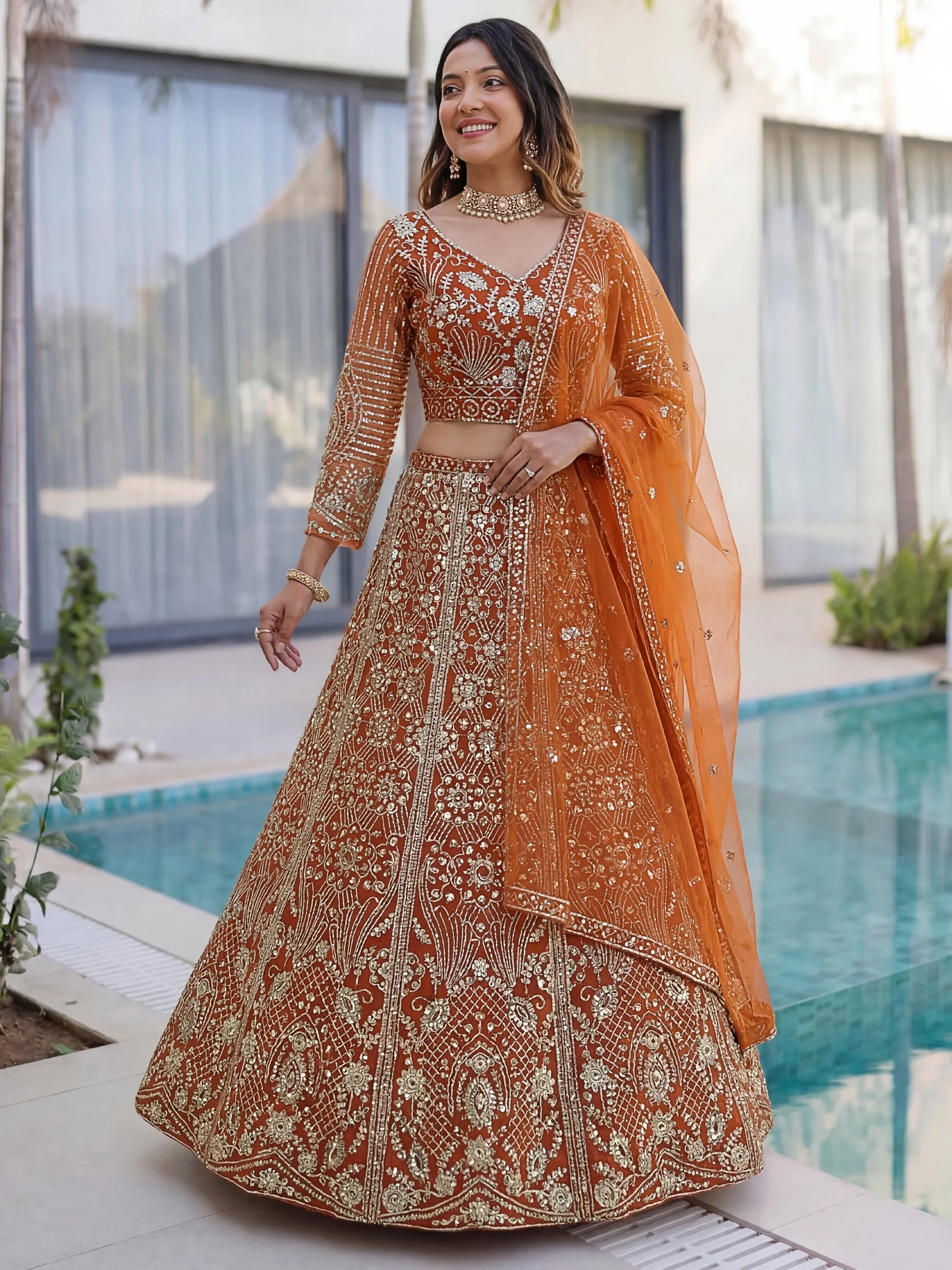 Orange Gorgeous Sequins Net Evening Wear Lehenga Choli With Dupatta