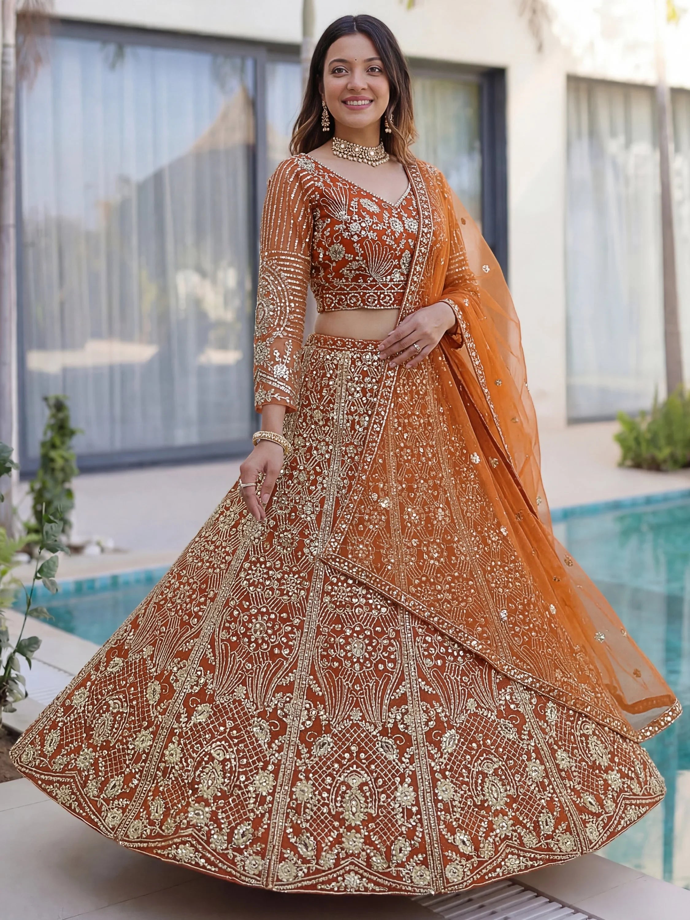 Orange Gorgeous Sequins Net Evening Wear Lehenga Choli With Dupatta