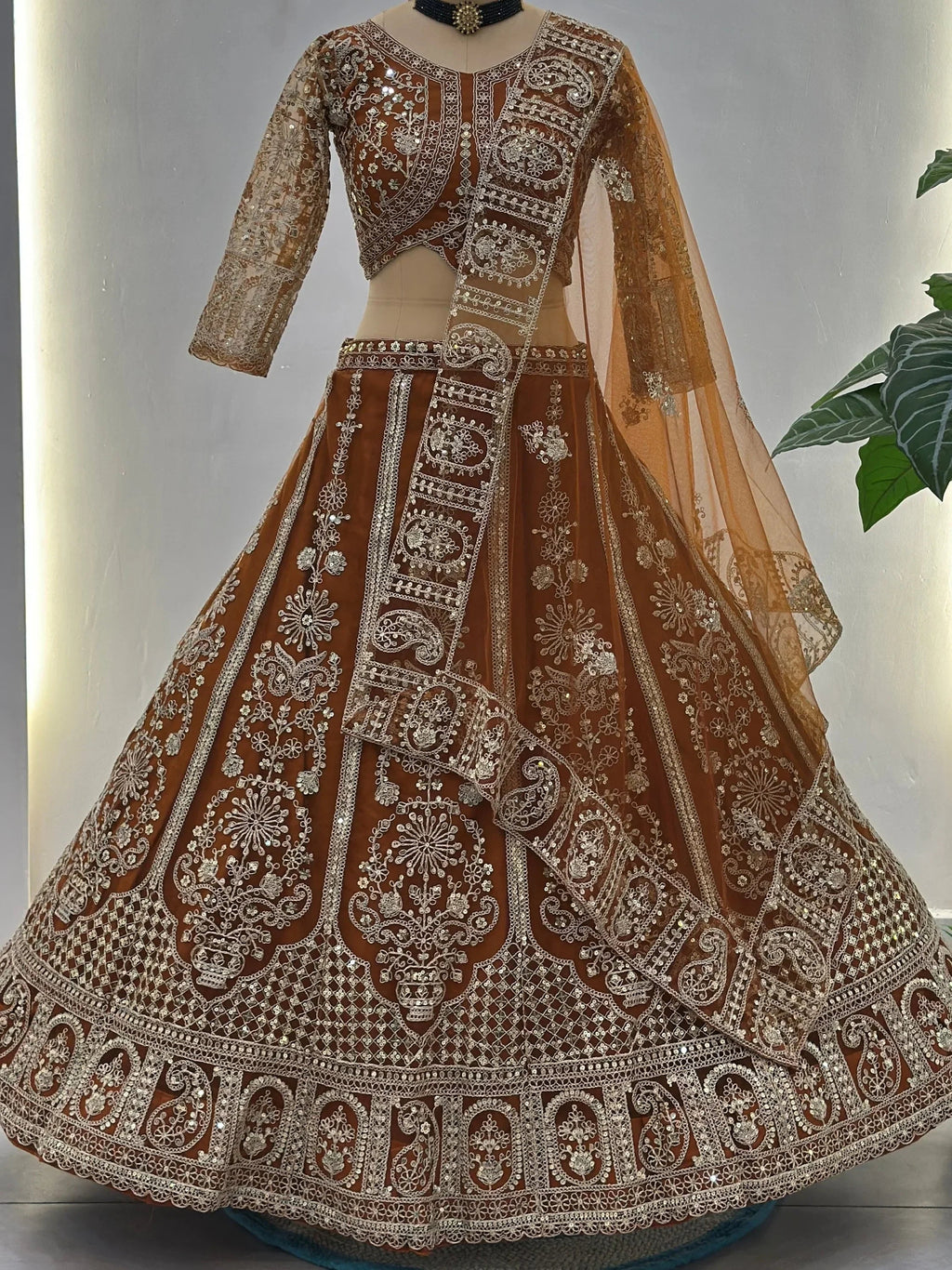 Orange Fabulous Embroidered Net Reception Wear Lehenga Choli