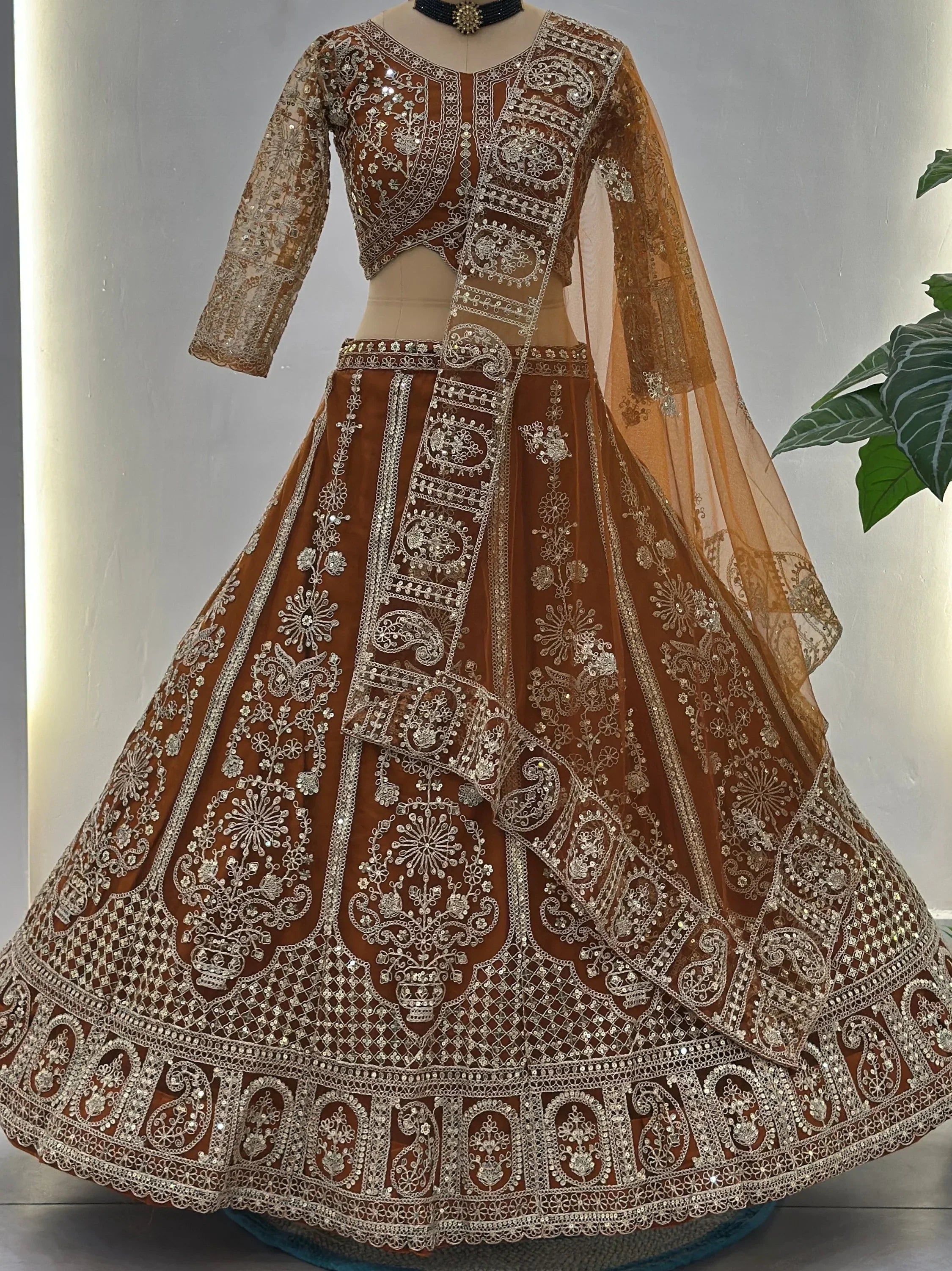 Orange Fabulous Embroidered Net Reception Wear Lehenga Choli