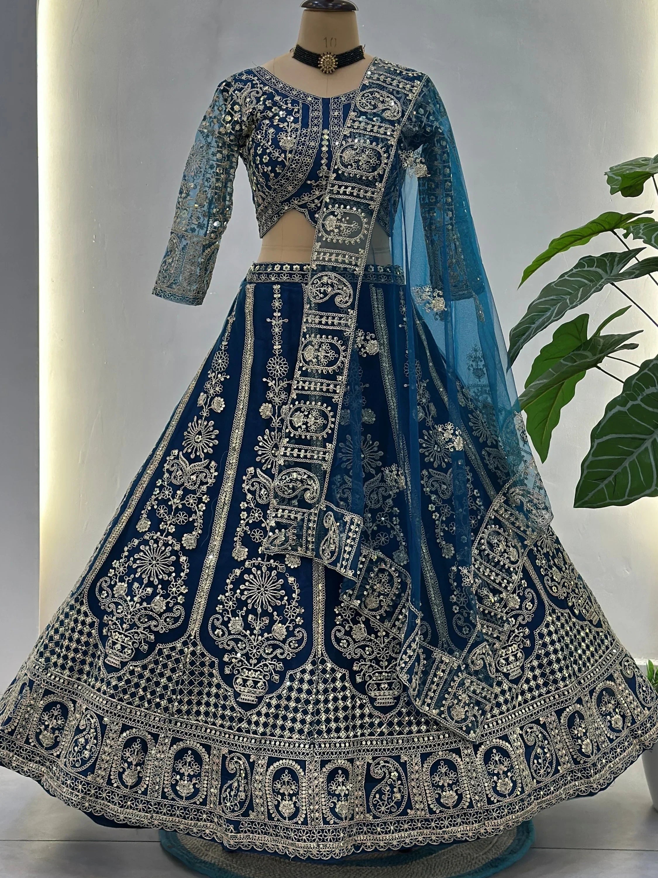 Teal Fabulous Embroidered Net Reception Wear Lehenga Choli