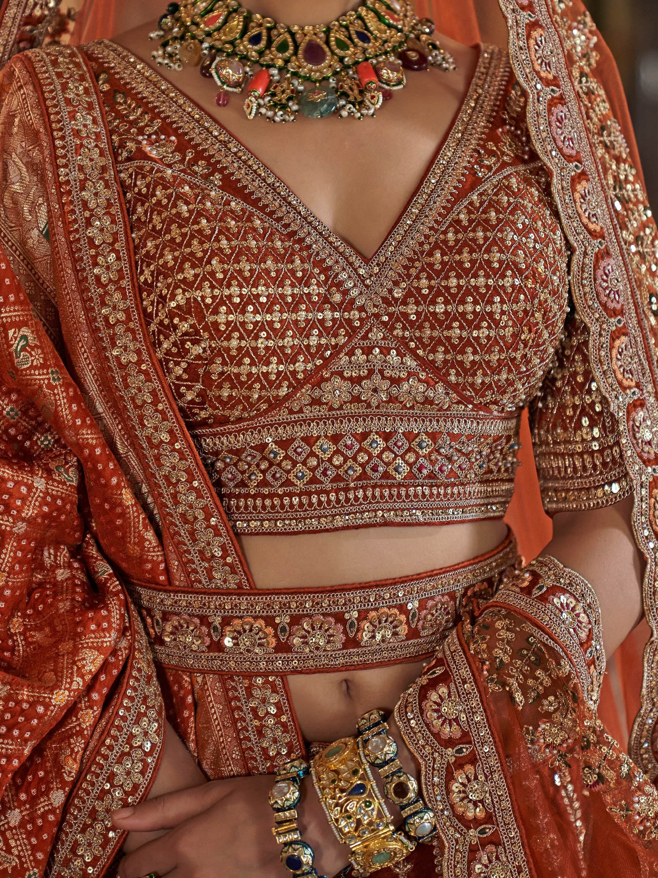 Good-looking Orange Pearl Work Silk Bridal Lehenga Choli With Double Dupatta
