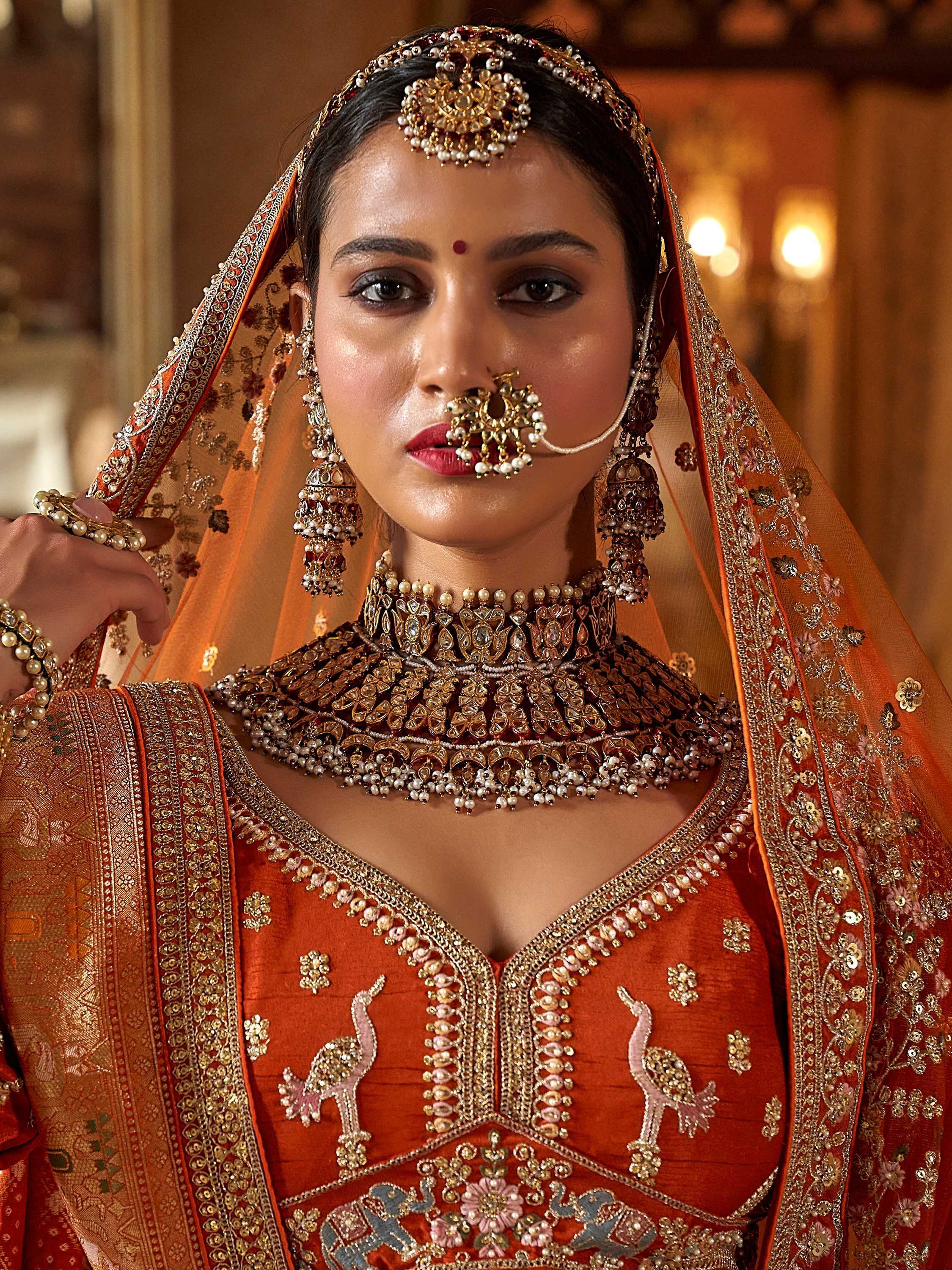 Enchanting Orange Pearl Work Silk Bridal Wear Lehenga Choli With Double Dupatta