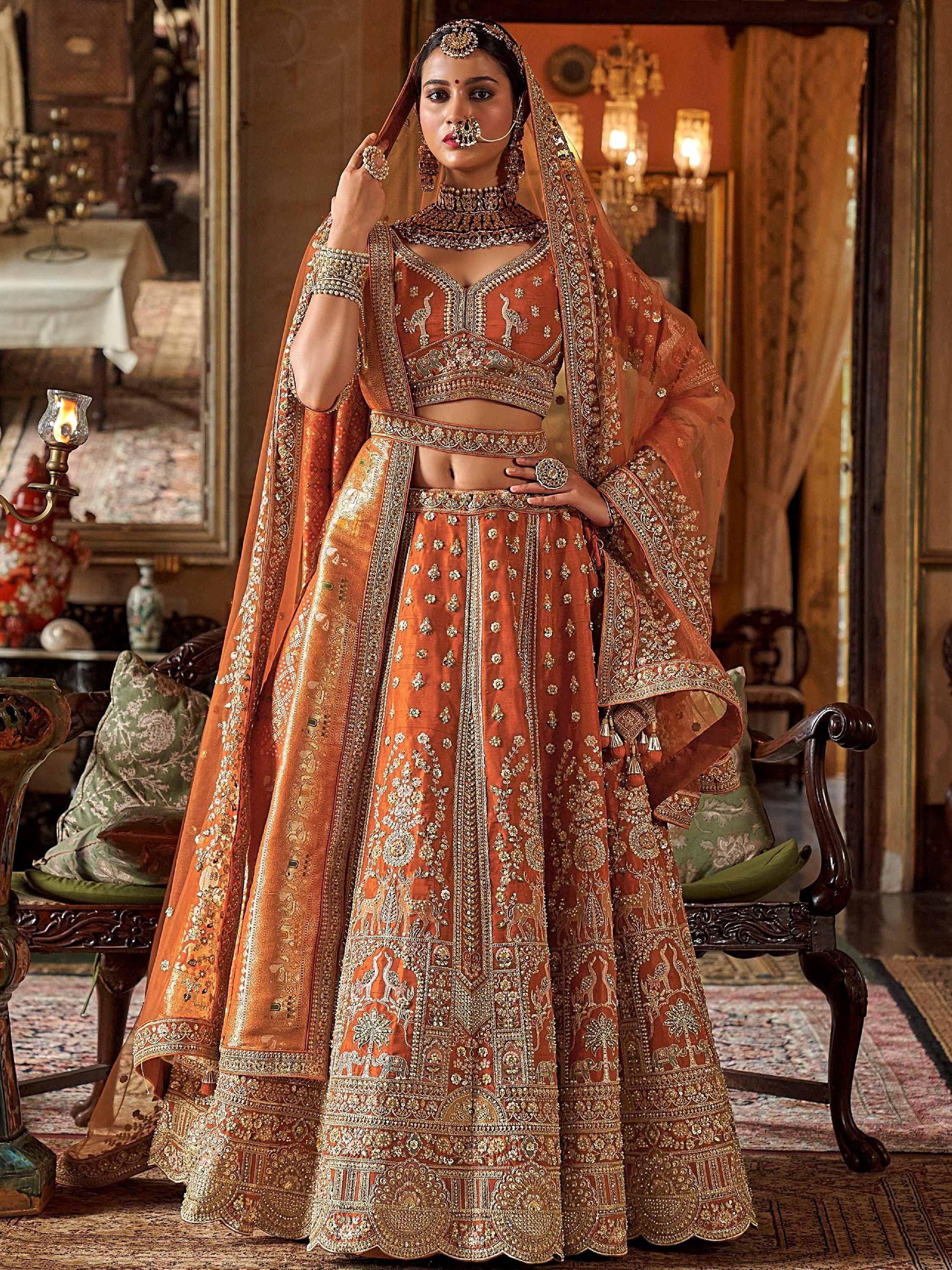 Enchanting Orange Pearl Work Silk Bridal Wear Lehenga Choli With Double Dupatta