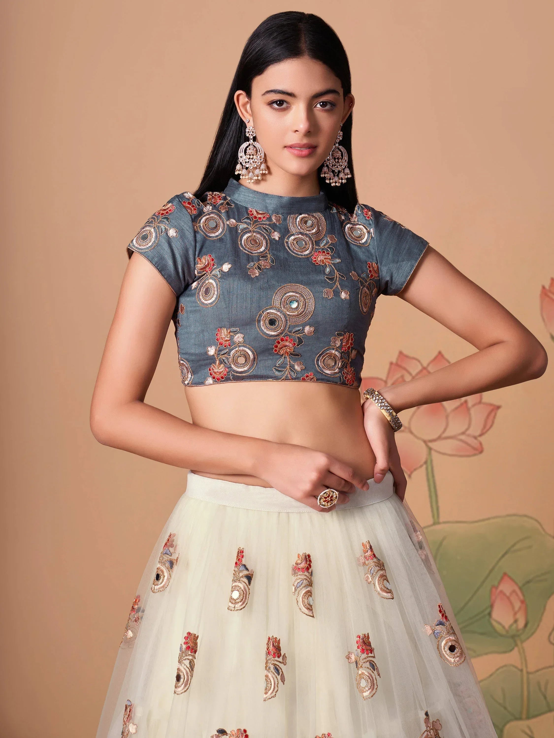 Ivory Pretty Embroidered Net Party Wear Lehenga Choli