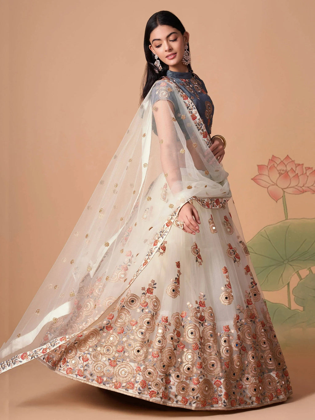Ivory Pretty Embroidered Net Party Wear Lehenga Choli