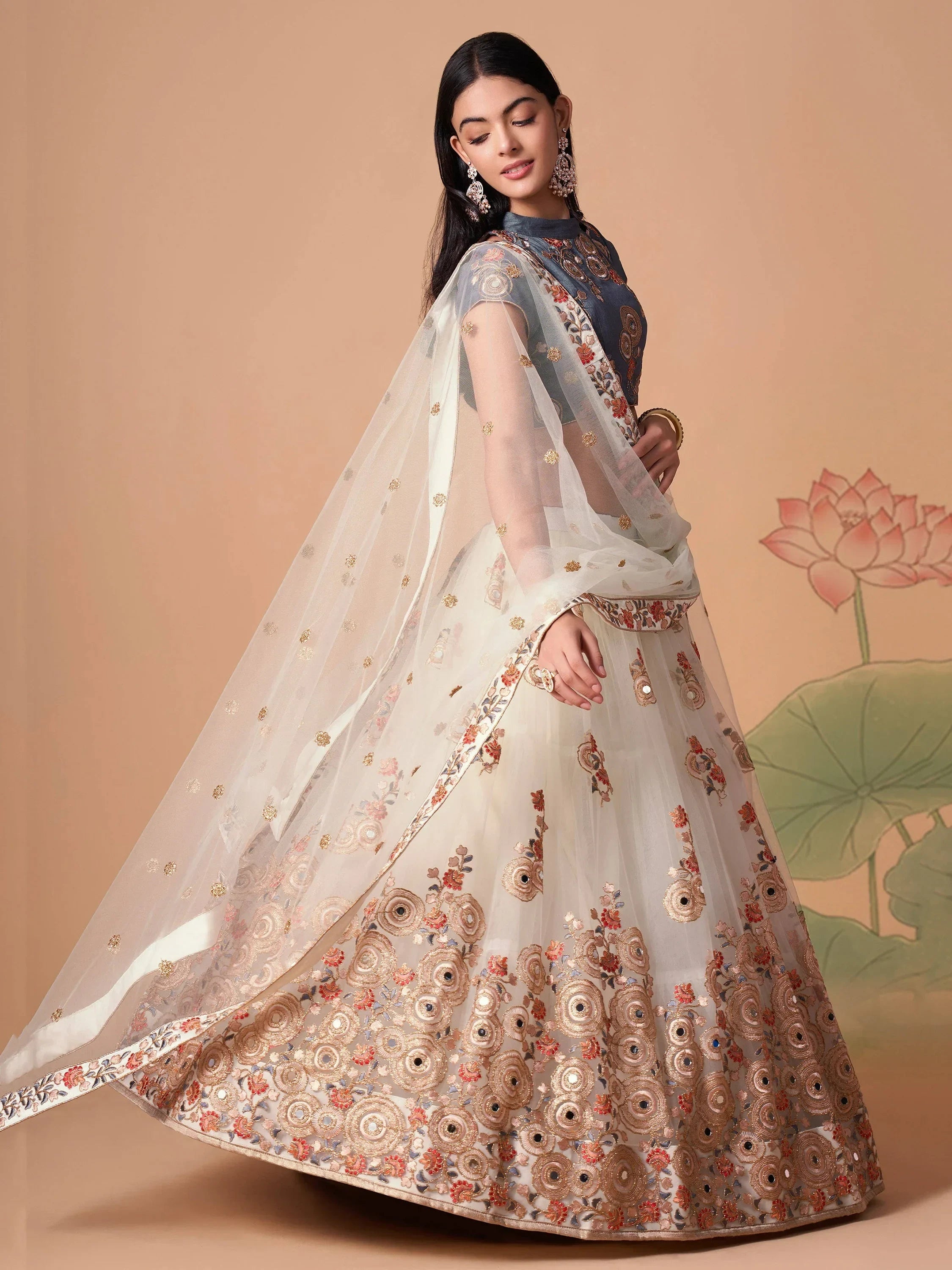 Ivory Pretty Embroidered Net Party Wear Lehenga Choli