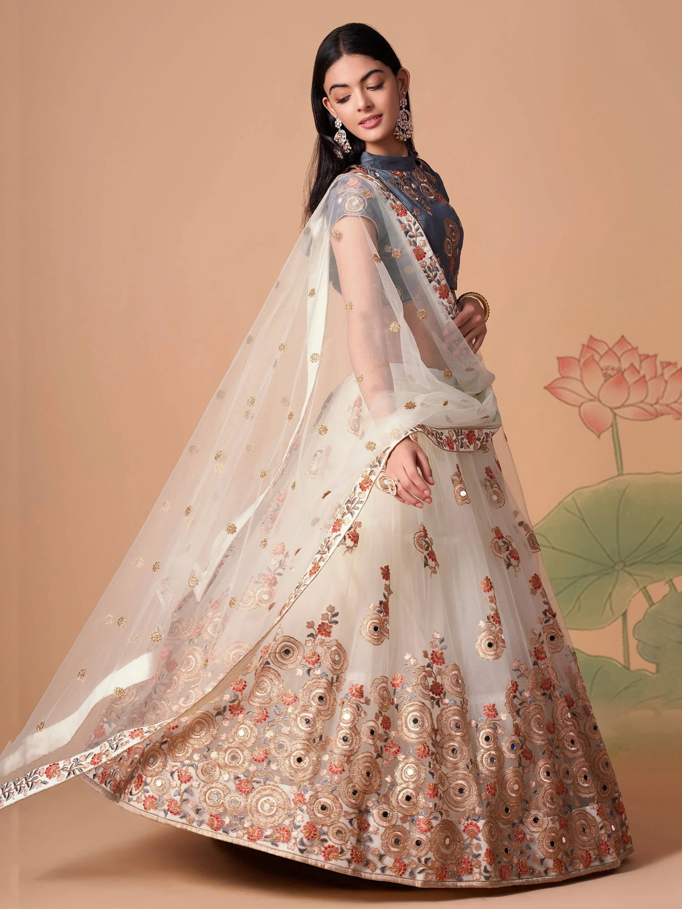 Off White Pretty Embroidered Net Party Wear Lehenga Choli