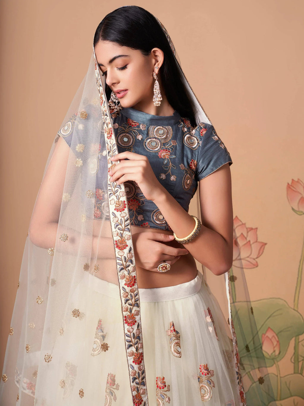 Ivory Pretty Embroidered Net Party Wear Lehenga Choli