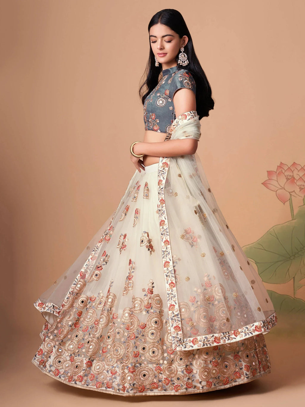 Ivory Pretty Embroidered Net Party Wear Lehenga Choli