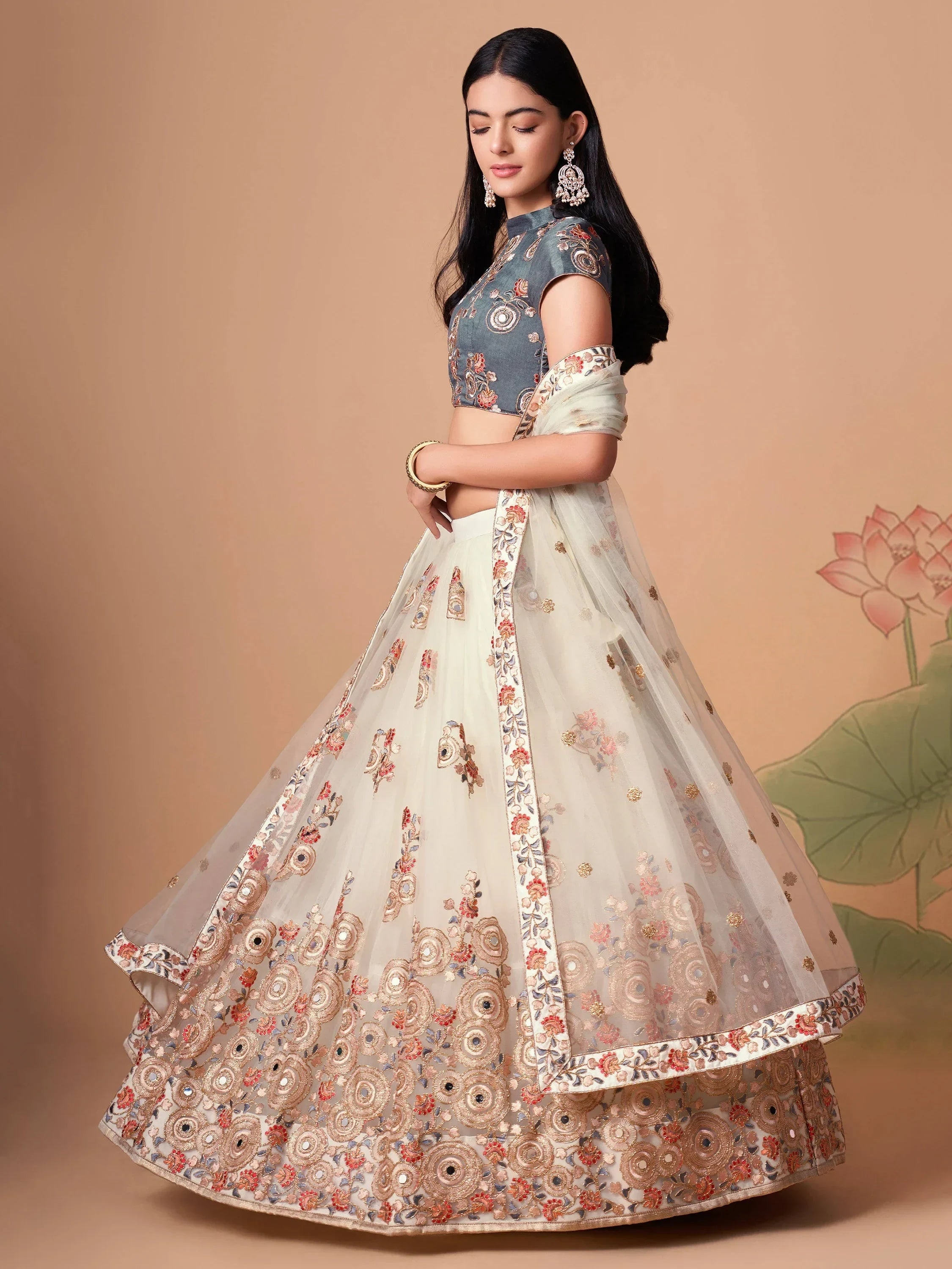 Ivory Pretty Embroidered Net Party Wear Lehenga Choli