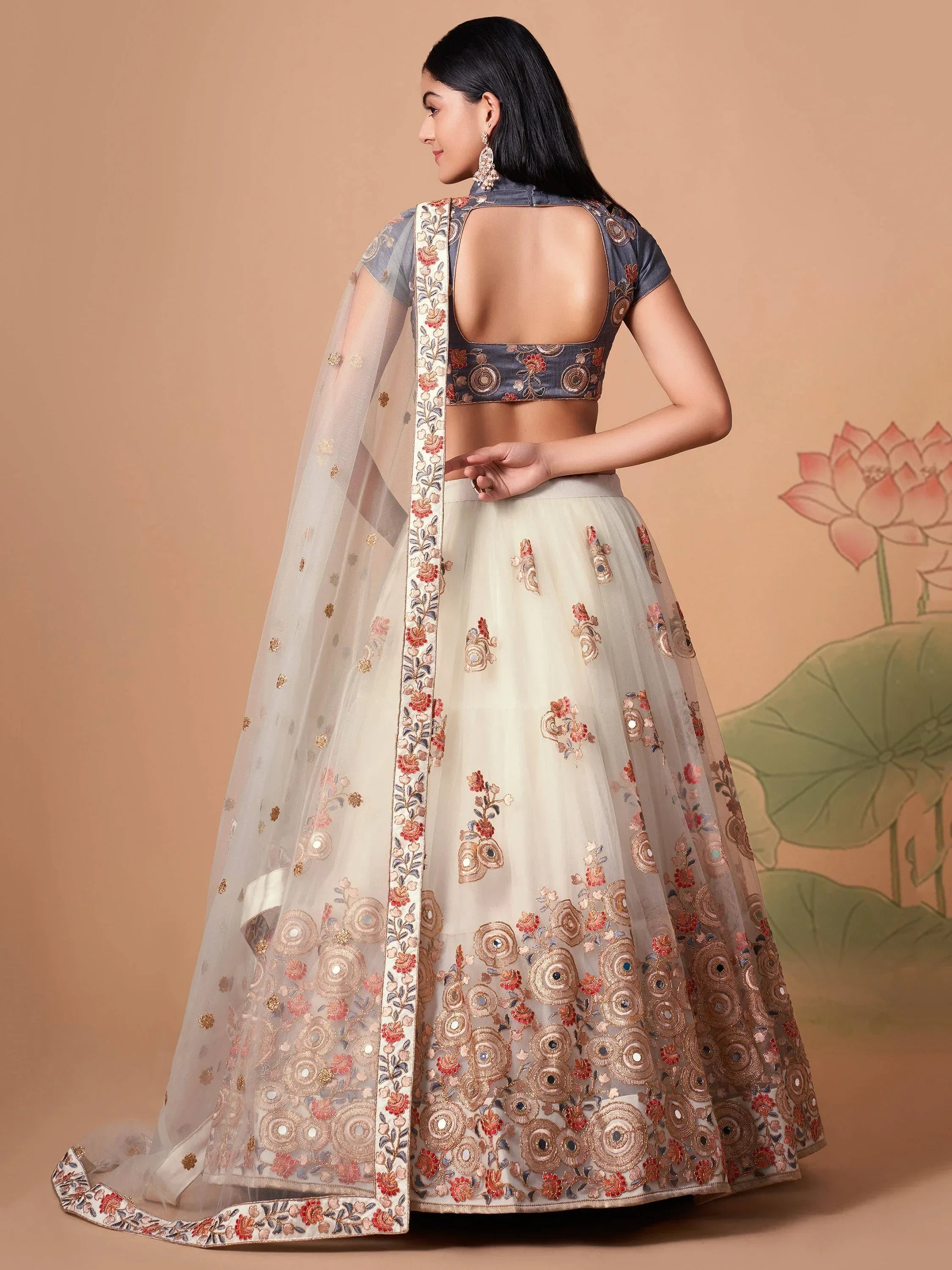 Ivory Pretty Embroidered Net Party Wear Lehenga Choli