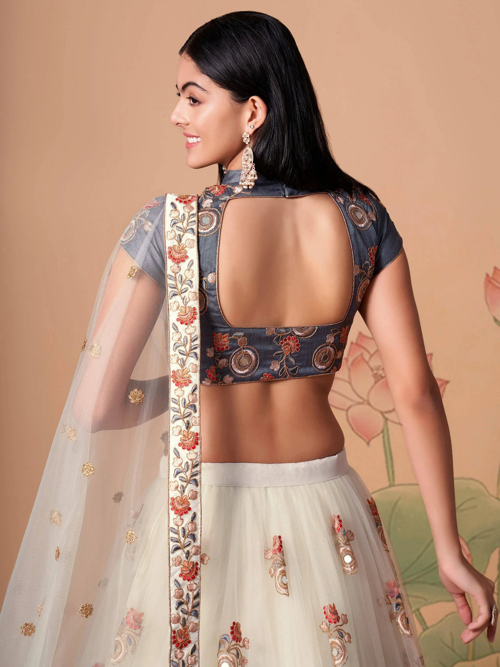 Off White Pretty Embroidered Net Party Wear Lehenga Choli