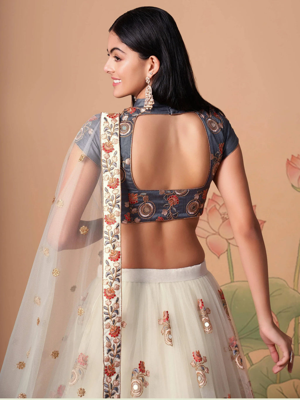 Ivory Pretty Embroidered Net Party Wear Lehenga Choli