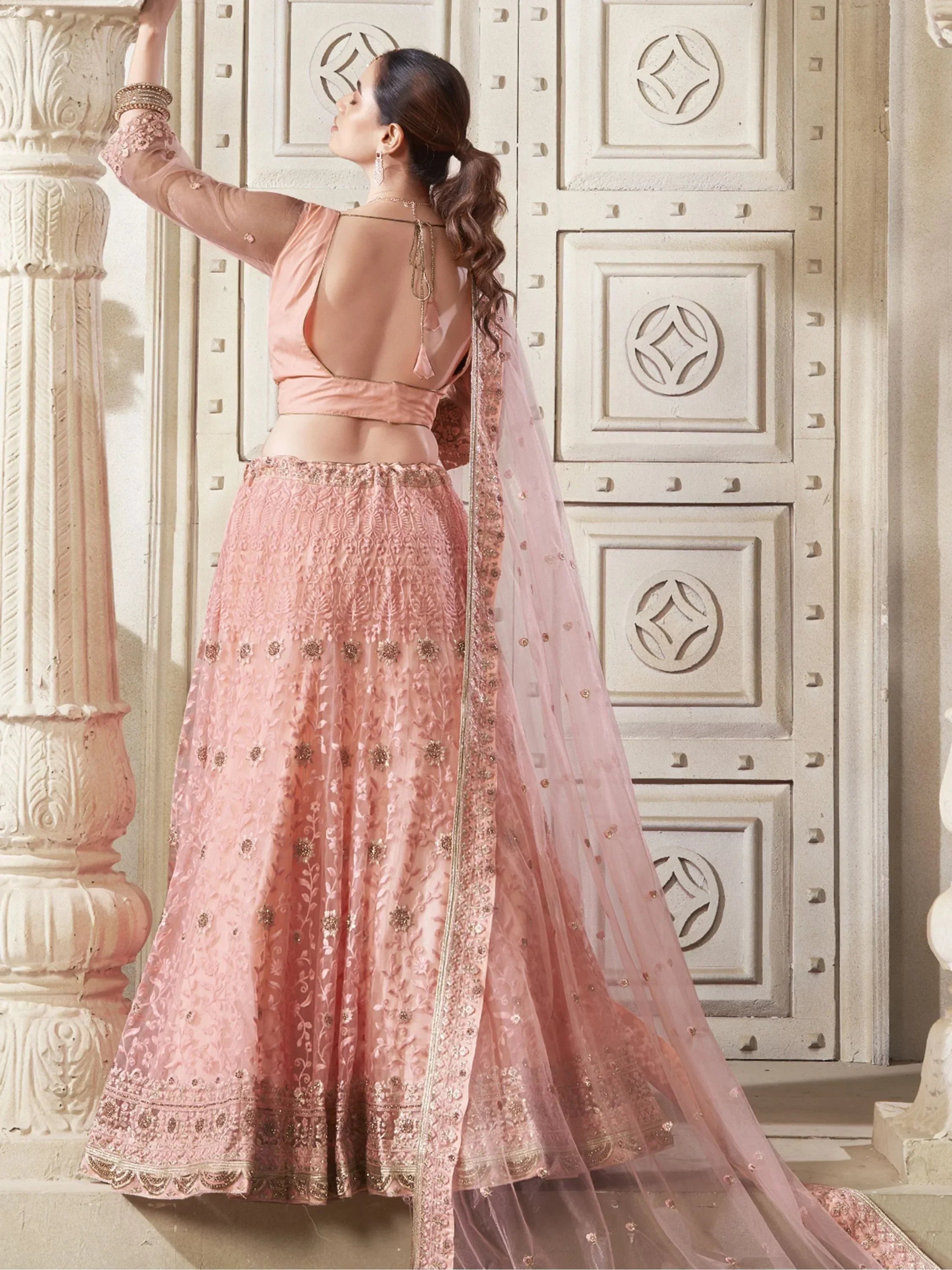 Adorable Peach Color Thread Work Net Engagement Wear Lehenga Choli