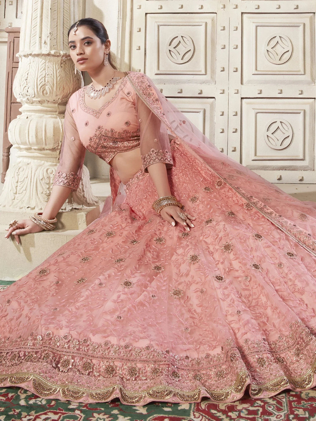 Adorable Peach Color Thread Work Net Engagement Wear Lehenga Choli