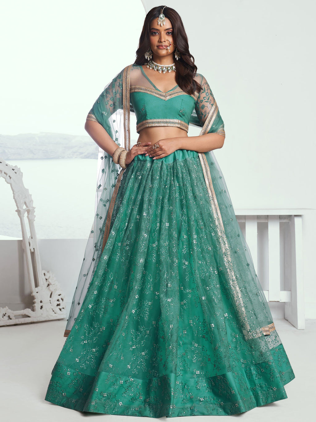 Amazing Rama Color Embroidered Net Engagement Wear Lehenga Choli