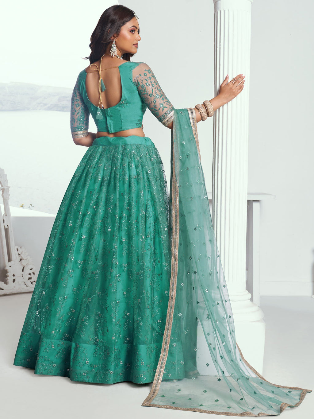 Amazing Rama Color Embroidered Net Engagement Wear Lehenga Choli
